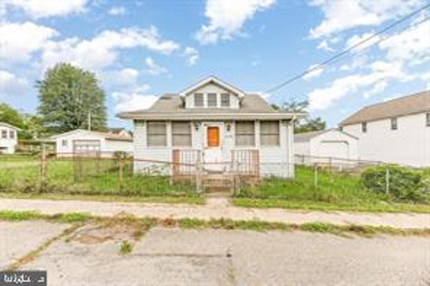 Exciting opportunity to own this charming 2-bedroom, 1-bath rambler located just three blocks from the beautiful Chesapeake Bay and the beach. Renovated in 1989, this home features a spacious, flat, fenced yard perfect for relaxation and outdoor activities. With two generously sized bedrooms and the added benefit of being zoned for both residential and town commercial use, this property is ideal for those looking to work from home. Seize this incredible opportunity—schedule your appointment today!