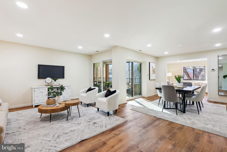 Looking for something a bit different with all the space that you really want in a quiet and convenient location?  Hurry to see this large home with a wonderful layout that provides remarkable privacy and lovely views out every window!  With two amply sized Bedrooms – each with its own private en-suite Bath--on opposite sides of the unit, you’ll find large and open Living and Dining Rooms at the center of your home, with a Family room / Den connected to the Updated Eat In Kitchen!  Want a little added sunshine?  Enjoy the large glass and screen-enclosed Porch overlooking trees!  With over 2000 Sq. Ft., you’ll have all the space and storage you’ll need, and you’ll love the updated features throughout the home! Updated Bathrooms, wood floors,  newer carpets in the bedrooms, recessed lighting, Stainless Steel Kitchen appliances ( including the convection oven and induction cooktop)!  Beautiful Kitchen cabinetry, counters, backsplash, and more!  How many condos do you find with an extra Powder Room for guests? You’ll also love your garage parking space and extra storage!  This boutique building is located on a quiet street in north Reston, within walking distance to Historic Lake Ann Plaza, where you’ll enjoy a fabulous Farmer’s Market, charming locally owned shops, restaurants, and multiple events! For an urban feel, Reston Town Center is only a mile away, offering fine dining, shopping, Look Cinema, an outdoor ice skating rink in winter, concerts in the summer, festivals, and more. Living in Reston provides access to 55 Miles of beautiful walking trails and incredible recreation facilities, such as abundant pools, basketball, tennis, and pickleball courts, and loads of picnic and pavilion areas!  Healthcare and transportation are available close by, including Reston Hospital, Metrorail Stations, bus service, and major roads such as Fairfax County Parkway, 267/Tollway, and I66. Dulles Airport is just 10 minutes away. It’s not just a home; it’s a lifestyle! Don’t miss this truly amazing home at an even more amazing price! **No pets building.  Offers are needed by 11:00 am Sunday.