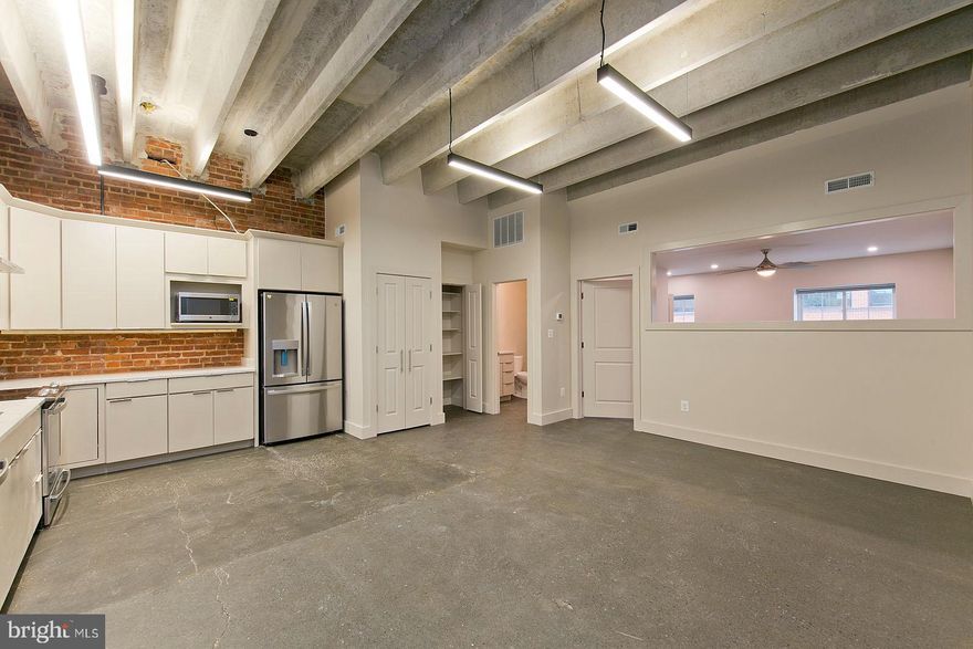 Industrial style loft on the downtown walking mall with masterful design and high-end finishes.  Sealed cement floors, high vaulted ceilings, wide open kitchen/living combination make this loft your desired spot for year or years depending on your stay in Winchester! Water/Sewer, Parking space, electronic locks( Latch/Butterfly) all included in rent.  RentSpree Required by all applicants/Pets case by case