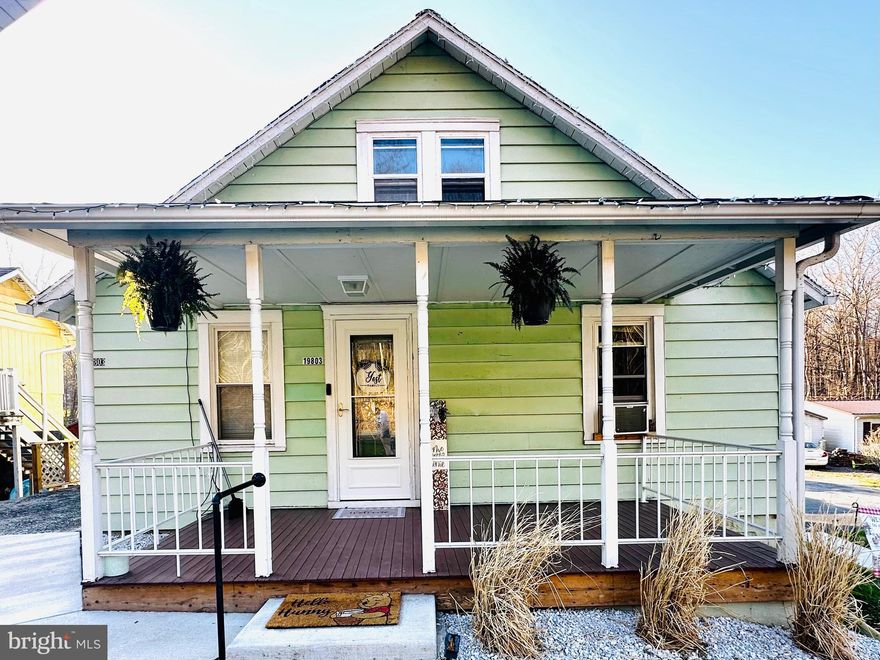 Welcome to this adorable bungalow in Rawlings, Maryland—perfect for a couple or someone just starting a family. This charming home offers inviting outdoor spaces, including a front porch, side porch, and a rear patio complete with a hot tub—ideal for relaxing or entertaining.

The flat, spacious backyard provides plenty of room for gatherings, play, or simply enjoying the outdoors. Step inside to a warm and welcoming living room that instantly feels like home. The flexible layout allows for a primary bedroom on the main level, making one-level living an easy option.

The spacious eat-in kitchen features ample cabinet space and is complemented by a convenient mudroom just off the back. Upstairs, you’ll find a comfortable bedroom along with a versatile bonus space—perfect for a home office, den, or additional living area.

The updated basement showcases beautiful natural wood walls and offers endless possibilities for a family room, guest space, or additional bedroom. You’ll also find plenty of storage and a dedicated laundry area downstairs.

This home combines charm, functionality, and flexibility—ready to fit your lifestyle!