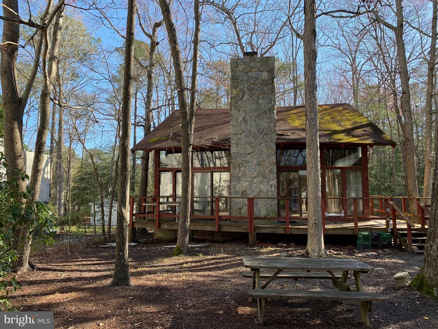 Vintage Ocean Pines investment opportunity privately nestled on a .32 acre lot ready to be revitalized. Home being sold as-is