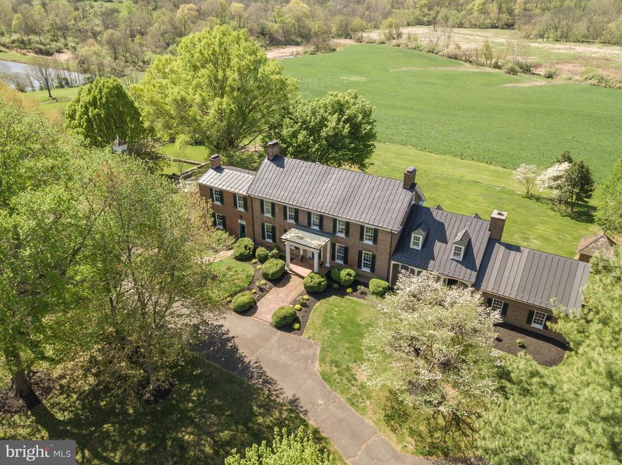 Sited in the bucolic Virginia countryside sits a home perched on 229 acres with a history as rich as the nation itself. The Shelburne Glebe House was built in approximately 1773 and has been witness to the Revolutionary and Civil Wars. Various updates through the years have allowed this historical treasure to adapt to the times, all while preserving the historical core of the home. From the hand sawn and craved beams that sit on the stone foundation to the wide floor planks, the character of this home seeps from every corner. Built by the order of the Anglican Church for George Washington's pastor, this was one of the first glebe houses in the United States.  In the present day the home features four bedrooms, one of which is an ensuite on the main level, a finished attic, stately dining and living rooms and center hall foyer. The guest house features two levels of living with two bedrooms and one bathroom and is perfectly positioned to enjoy a view of the lake. The six-stall barn with hayloft is move-in ready for your horses. Preserving the majestic nature of the property, the home and property are in various preservation easements including an easement held by the Virginia Department of Historic Resources and Loudoun County, inclusion in both the National and Virginia Historic Register of Places. Additionally, the estate is the Goose Creek Historic District.  The land is in land use and the seller is not responsible for roll-back taxes. The new owner will continue to be a steward of history whilst enjoying the serenity and beauty found within this unique parcel of land.