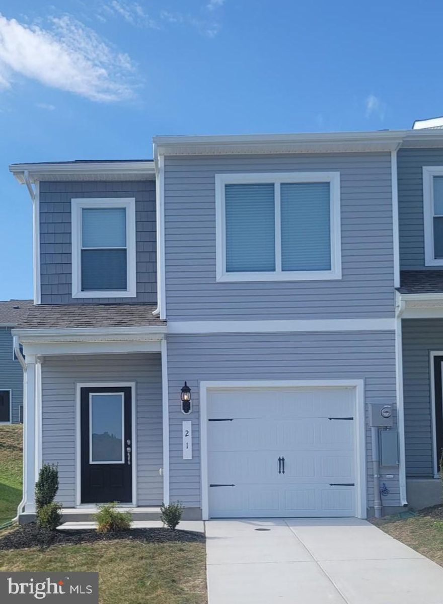 The Robertson is a spacious and modern 3-bedroom, 2.5-bath townhome from LGI Homes at Homeplace at Riverside in Falling Waters. Enjoy all the benefits of homeownership with the Robertson, which offers an open entertaining area on the main level, where your family will enjoy a chef-ready kitchen featuring an island and stainless steel appliances, as well as a spacious family room and dining area. Upstairs, retreat to the incredible owners suite where you will find enough space for a king-sized bedroom suite and a luxurious bathroom with a soaker tub and separate shower. Two more generously sized bedrooms, a second full bath and a laundry room provide the additional space you desire upstairs. Homeplace at Riverside offers gorgeous new homes and a peaceful, relaxed lifestyle with a neighborhood park, playground, picnic area and walking trails. The community's serene setting near I-81 positions you for easy access to big-city amenities in Baltimore or Washington D.C. as well as nearby shops, restaurants, schools and parks.