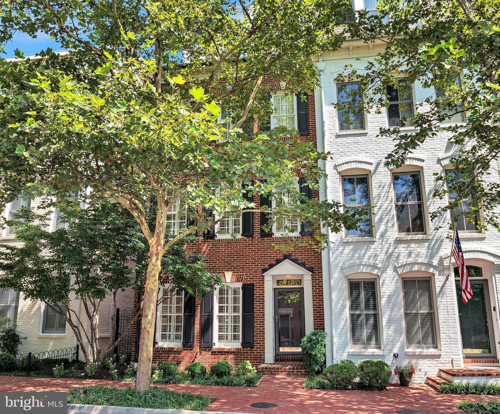 Welcome to 715 Carpenter Road, a beautifully all-brick end-unit townhome nestled in the sought-after community of Potomac Greens. With over $52,000 in updates, including a new roof (2022), fresh paint, and new carpeting (2025), this residence offers timeless design, exceptional flow, and refined finishes throughout.
The entry level welcomes you with a ceramic-tiled foyer, an elegant study with French doors, recessed lighting, and ceiling speakers. The finished two-car garage includes a hose bib, keypad entry. A convenient hall closet and electric entryway heater complete this level.
Upstairs, the main living area showcases hardwood floors, high ceilings, plantation shutters, recessed lighting, crown molding, and oversized baseboards. The gas fireplace with classic mantel and slate surround serves as a stunning focal point in the living room, which also includes built-in ceiling speakers for ambient sound.
The gourmet kitchen is the heart of the home, featuring granite countertops, a grand center island with breakfast bar, designer cabinetry with crown molding, a stone tile backsplash, and a built-in desk. Appliances include a four-burner gas cooktop, double wall ovens, built-in microwave, dishwasher, disposal, and a double undermount stainless steel sink. A spacious pantry offers additional storage.
The owner’s suite is a spacious retreat with a bay window, hardwood floors, plantation shutters, ceiling speaker, crown molding, and a large walk-in closet. The en-suite bath is outfitted with a marble dual-sink vanity, a free-standing soaking tub, a walk-in shower with bench, Kohler fixtures and commode, a linen closet, a mirrored medicine cabinet, and diagonally laid tile flooring for a designer touch.
The bedroom level laundry includes a front-loading washer and dryer for added convenience. A second spacious bedroom offers a walk-in closet and access to a full bath with a tub/shower combination. The top-level loft features vaulted ceilings, a ceiling speaker, and an additional living space that opens to a private rooftop terrace with hose bib perfect for relaxing or entertaining. A third bedroom on this level features a walk-in closet, en-suite bath with shower, and an additional storage area.
Additional highlights include oak staircases with white spindles, carpet from the third to fourth floor, plantation shutters throughout, two-zone heating and cooling, and a powder room on the main level with a Kohler pedestal sink and commode.
Located in the desirable Potomac Greens community, residents enjoy access to a stately clubhouse with meeting and party rooms, a fitness center, an outdoor heated pool, landscaped pocket parks, tot lots, scenic nature trails, and Capital Bike Share stations. The community is just moments from the new Potomac Yard Metro, Amazon HQ2, Virginia Tech’s Innovation Campus, and the shops and restaurants of Old Town Alexandria and Del Ray. With easy access to the George Washington Parkway, Mount Vernon bike trail, and major commuter routes including I-495, I-395, and I-95, and just two traffic lights to downtown D.C. and Reagan National Airport, this home combines elegance, lifestyle, and convenience in one exceptional offering.
For a full list of features and detailed floor plans, please refer to the Documents section.