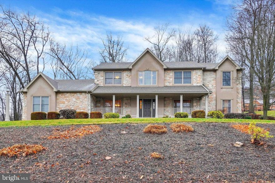 Welcome to this stunning 5 Bedroom home nestled in the desirable Mountaindale community! Totaling over 3,390 square feet of finished living space, this home boasts amazing features and thoughtful details throughout. Step into the grand foyer with hardwood floors and vaulted ceilings which sets the tone for the elegance that awaits. The French door leads you into the living room with carpet, crown molding and window treatments, this could also serve as a wonderful office space. Entertain guests in the formal dining room complete with carpet and crown molding. The eat-in kitchen features hardwood floors, vaulted ceilings in dining area, tile backsplash, convenient bar area, cambria quartz countertops, stainless steel appliances, double ovens and outdoor access to the patio. The kitchen is open to the cozy family room adorned with hardwood floors, window treatments and a stone gas fireplace, this is a great location to relax and enjoy the view from all the windows that provide lots of natural light. Main level bedroom provides convenience with carpet, ceiling fan, window treatments, walk in closet and an attached full bath. Updated Main level laundry with tile floors, utility sink, built in cabinets and a coat bench. Venture upstairs to discover four generously sized bedrooms. Primary bedroom offers a spacious tranquil retreat with carpet, window treatments, ceiling fan, large walk-in closet and an updated full spa-like bathroom with tile floors, double vanity, soaking tub and luxurious oversized tiled shower. A convenient Jack and Jill bedroom/bathroom set up. An unfinished basement provides plenty of storage space and offers large built in shelves for organizing. Lovely, enclosed sunroom features a ceiling fan and leads out to the patio overlooking the partially fenced backyard with beautiful wooded views. Oversized Three car garage and driveway offers a nice turn around area. Some rooms offer new carpet, Newer garage doors in 2017. Master bath remodel in 2019. Newer water heater in 2019. Newer UV light in 2023. Conveniently located to shopping, dining, entertainment and highways. Home has been pre-inspected. Truly, a joy to own!