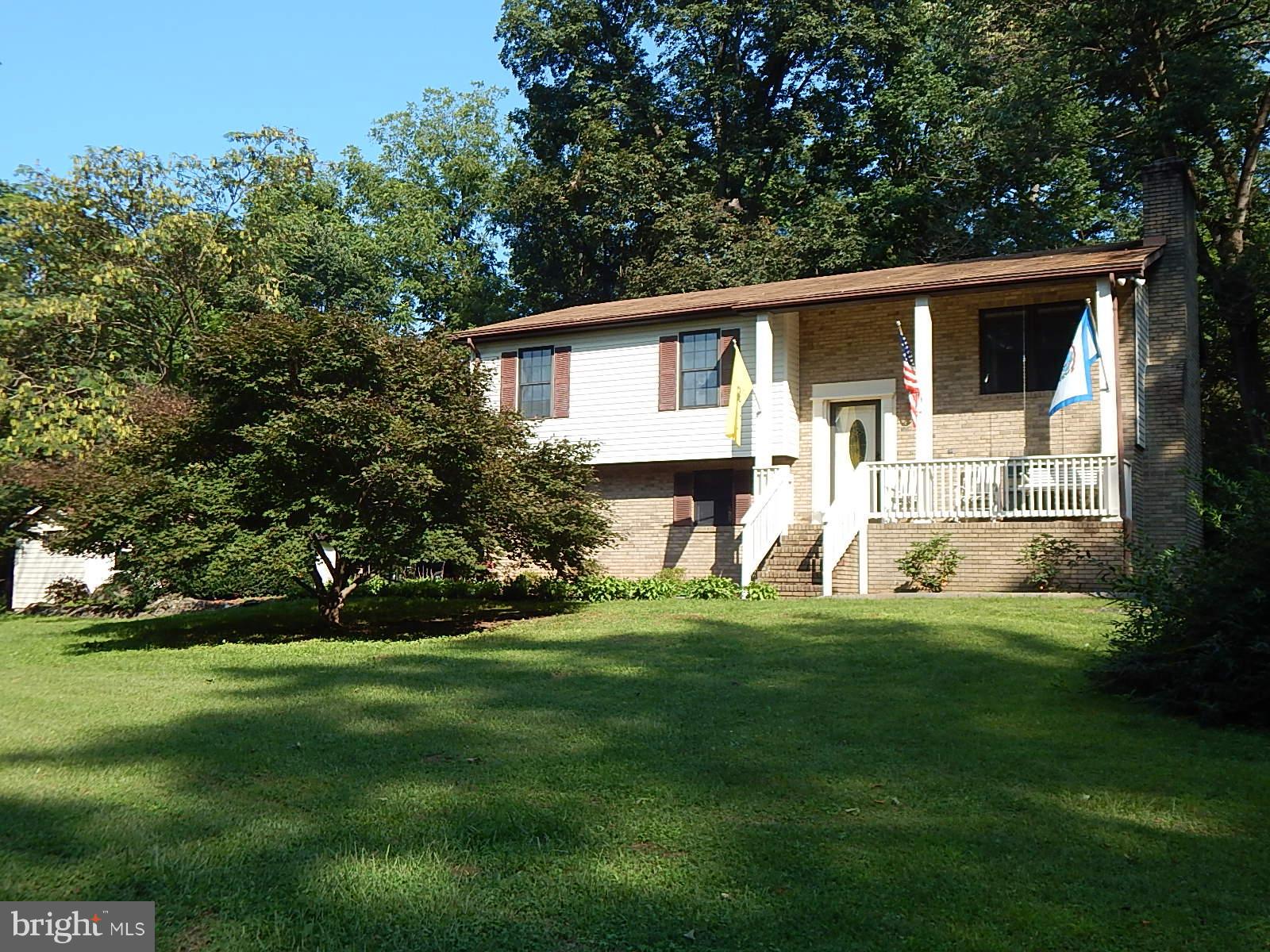Here it is! A Private Home on 5 Unrestricted Acres minutes from Historic Shepherdstown! Away from the Hustle & Bustle, Surrounded by Mature Trees yet close enough to town & amenities. This Home has 3 Bedrooms, 2.5 Baths, Living Room w/ a Fireplace, Sep Dining, Family Room w/ Elec Fireplace, 2 Car Gar, 16X35 Detached Work Shop/Man Cave & Level Yard w/ a large Fire-pit that's great for entertaining!