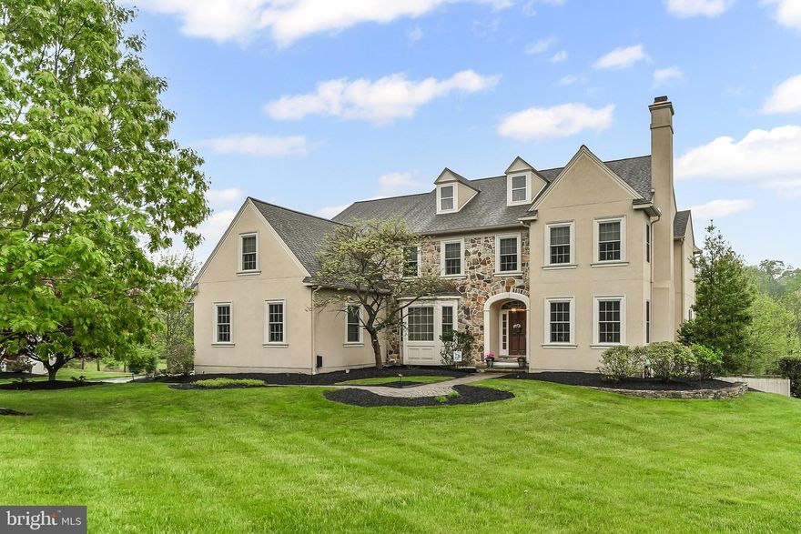 Welcome to 2 Remington Lane, an exquisite estate nestled on a picturesque, tree-lined double cul-de-sac in the highly sought-after Pennwyck community of Malvern. This exceptional home offers a rare blend of comfort, walkability and convenience ! Crafted with the finest materials and meticulous attention to detail, this residence offers over 5,100 square feet of luxurious living space featuring five bedrooms, three full bathrooms, and three powder rooms. From the moment you arrive, you’ll be captivated by the professionally landscaped gardens, mature trees, and extensive hardscaping that surround the property—creating a peaceful, picturesque setting with breathtaking views in every direction. Step into a naturally bright, thoughtfully designed floor plan. The elegant living room features  an abundant natural light, a custom fireplace with a handcrafted mantel, and beautiful site-finished hardwood floors that run throughout much of the main level. Adjacent is a private alcove with a cloak closet, the first of two powder rooms, and a set of French doors opening into a handsome home office with custom built-in bookcases and views of the stunning backyard—this space could easily convert into a first-floor bedroom suite if desired.The formal dining room is both spacious and inviting, with a large front bay window, beautiful chandelier, and access to a stylish butler’s pantry featuring custom cabinetry, stone counters, and a beverage refrigerator—ideal for entertaining. The heart of the home is the recently renovated chef’s dream kitchen, featuring: 42” custom cabinetry,high-end  appliances, five-burner gas cooktop, expansive center island with fabulous bonus storage under the sitting area, coffee/tea bar and walk-in pantry along and counters that go on and on, as the kitchen expands to a light-filled breakfast room with atrium doors leading to a serene andlovely screened-in porch ( with access to outside entertaining patios)—complete with cathedral ceiling, ceiling fans, and custom wood floors—perfect for relaxing or entertaining. Adjacent to the kitchen is the dramatic great Room, both large and yet intimate featuring a cathedral ceiling, an expansive wall of floor-to-ceiling windows, bringing in the seasons of color, all with custom window coverings, and a masculine and warm custom stone gas fireplace. A spacious mudroom off the kitchen includes its own patio and side entrance and offers a built-in storage bench, abundant closet space, and the second powder room—conveniently located as you enter from the attached oversized 3-car garage.
Upstairs, the primary suite is a true retreat, offering: A separate  sitting  area, custom walk-in closets, Spa-inspired bath with soaking tub, dual vanities, and a separate shower. Four additional bedrooms are located on this floor, with each two bedrooms hosting its own beautifully updated bathrooms suites. A most convenient second-floor laundry room, closets galore, and a back staircase leading to the kitchen/mudroom complete the upstairs floor.
The finished lower level  offers versatile living space, including: a Home gym, Hobby/office area -a discretely situted and very welcoming powder room close to the walk-out sliding glass doors. The custom sliders and large windows have incredible silhouette shades that offer a peek of natural light to come through and yet privacy when you are enjoying your lower level get away.
The sliders take you outside to your own custom in-ground pool, expansive patios, enclosed by wood post-and-rail fencing and surrounded by lush gardens and wooded open space—offering the ultimate backyard oasis.
Enjoy the best of Malvern living with walkable access to, Malvern Borough shops & restaurants, Monument Park and its trails,  Saturday Farmers Market, Malvern Train Station, Fabulous Shops and Restaurants, and Malvern Victorian Christmas tradition.
This home truly has it all—luxury, location (walkability), and lifestyle. Welcome Home!