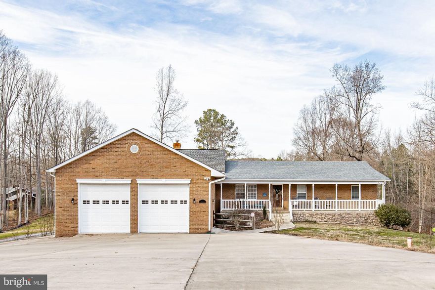 Welcome to this amazing home away from home in the wonderful gated Rockland Creek Estates community on Lake Anna! As you drive in, you will notice the astroturf soccer field to your right and tons of parking for all of your guests in front of you, including covered boat/RV parking on the side of the home and the massive attached garage with oversized doors. As you enter the main foyer of the home, you will find your way into the updated main kitchen with granite countertops and stainless steel appliances, which leads to the enormous, open family room, dining area, and sunroom overlooking the gorgeous 1.5+ acre property. You will also find a home office, 3 bedrooms, 2 updated full bathrooms, and laundry on the main floor. Downstairs you will find an additional kitchen, additional bedrooms, 2 more full bathrooms, a second family room, bonus rooms which can be used in a way that suit your family and friends, and a second laundry room. When you exit the rear of the home, you will be greeted by a covered deck overlooking the pool, sun deck, hot tub, and massive rear yard. Follow the sidewalk past the storage shed down to the lake where you will find a huge boat dock with multiple slips, jet ski lifts, covered boat lift and boat house. Swim right off the dock by taking a trip off the slide or spend time on the sandy beach. Take a boat trip to all the restaurants and amenities Lake Anna has to offer. This home is currently set up to sleep upward of 20 people and all furnishings/kitchenware/glassware/etc. are to convey with the home for your immediate enjoyment. This home makes for a great income producing property and/or a great property for your family to be able to escape from the stresses of life and enjoy some much needed relaxation. Come see all that this home has to offer! Schedule your showing today! *Pictures/Video coming Friday*