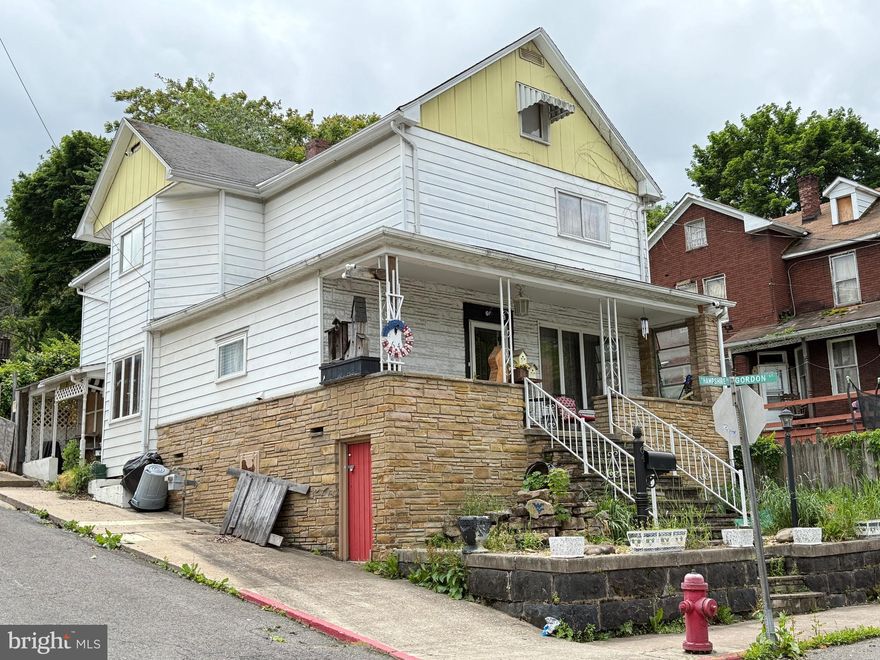 MAINTENANCE-FREE 4 BEDROOM, 1 ½ BATH 2-STORY HOME ON CORNER LOT. MAIN FLOOR OFFERS FOYER WITH OAK STAIRWAYS & BALISHTER LEADING TO THE SECOND FLOOR, LARGE LIVING ROOM W CEILING FAN/LIGHT, ELECTRIC FIREPLACE, WOOD PANEL WALLS AND LAMINATED H-WOOD FLOORS. DINING ROOM INCLUDES WOOD PANLE WALLS, DECORATIVE HANGING CEILING LIGHT, 4’ WET BAR OPEN TO KITCHEN AND LAMINATED H-W FLOORS.  SPACIOUS KITCHEN W ALL APPLICANCES, METAL TILE CEILING, TILE BACKING UNDER CABS, SMALL PANTRY, WOOD PANEL WALLS, LAM. H-WD FLOORS AND ACCESS TO SUNROOM WHICH CONTAINS CERAMIC TILE FLOORS, NEW SLIDING GLASS DOOR & RUFF CUT WALLS.   LAUNDRY ROOM INCLUDES FRONT LOADING WASHER/DRYER AND ½ BATH.  SECOND FLOOR HAS 4 BEDROOMS W WOOD FLOORS, TILE CEILINGS, WOOD PANEL WALLS & AMPLE CLOSET SPACE. OTHER AMENITIES: FULLY FINISHED ATTIC W STAIRS, SECURITY SYSTEM CONVEYS, 9’ CEILINGS, HAS HOT WATER HEAT, FULL BASEMENT W OUTSIDE ACCESS, SMALL FRONT YARD AND WELL WORTH THE ASKING PRICE.