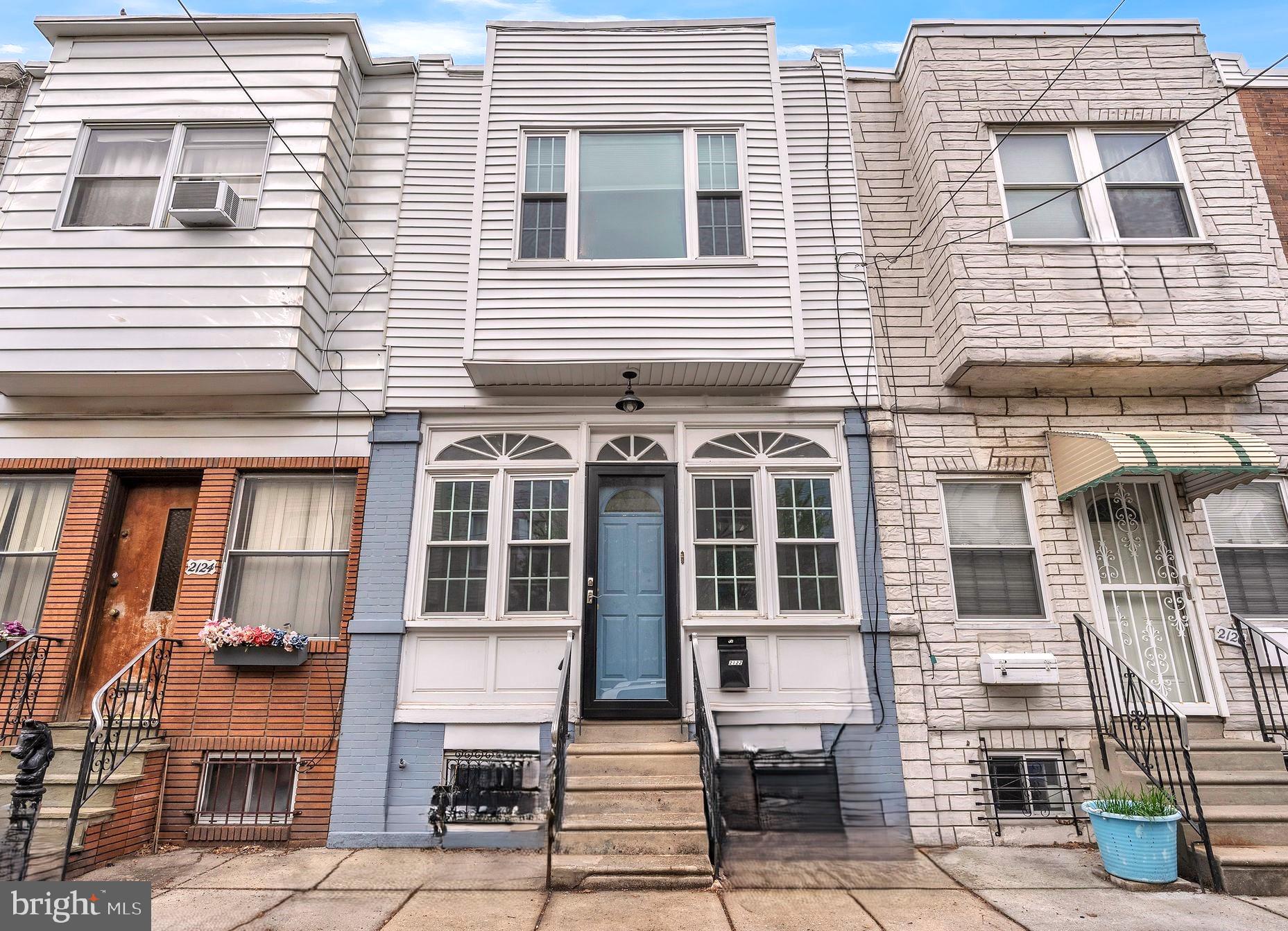 Be a part of the vibrant West Passyunk neighborhood! This beautifully updated townhome is a real unicorn with GARAGE PARKING!! You read that right, private, off-street PARKING in South Philly! Fully renovated and restored in 2016 and meticulously maintained by its current owners, this charming home combines original character with modern amenities. Perfect as a starter home or investment property. The front facade features a fresh palate of painted brick, light siding, the original marble steps and a distinctive blue door. Upon entering, you'll discover a quaint, tiled mudroom area perfect for shedding coats, shoes and the burdens of the day. The living space welcomes you with an expansive open floor plan, original oak hardwood flooring and oak staircase. The first floor is flooded with natural light and provides plenty of space for the living and dining areas and the kitchen on this level. The modern kitchen features white cabinetry, SS appliances, quartz counters and gas cooking, perfect for entertaining! Recessed lighting and newly painted neutral walls complete this level. Out back you'll find a private patio just large enough for your BBQ grill and a dining table for two. Here you'll also find your private, detached GARAGE accessed by a shared driveway in the rear. The garage provides space for one car plus ample storage. The stairs to the 2nd floor retain the original wood railing and oak treads. Upstairs you will find 3 nicely sized bedrooms and a completely renovated hall bath with tub/shower featuring neutral, yet striking white subway tile. All bedrooms have original hardwood floors. Finally, head down to the tiled basement which provides loads of storage, fresh white paint and a convenient laundry area. Easy access to the trendy restaurants and shops of East Passyunk and an easy commute to Center City via Broad St. make this location ideal. Move-in ready! Don't miss this one!