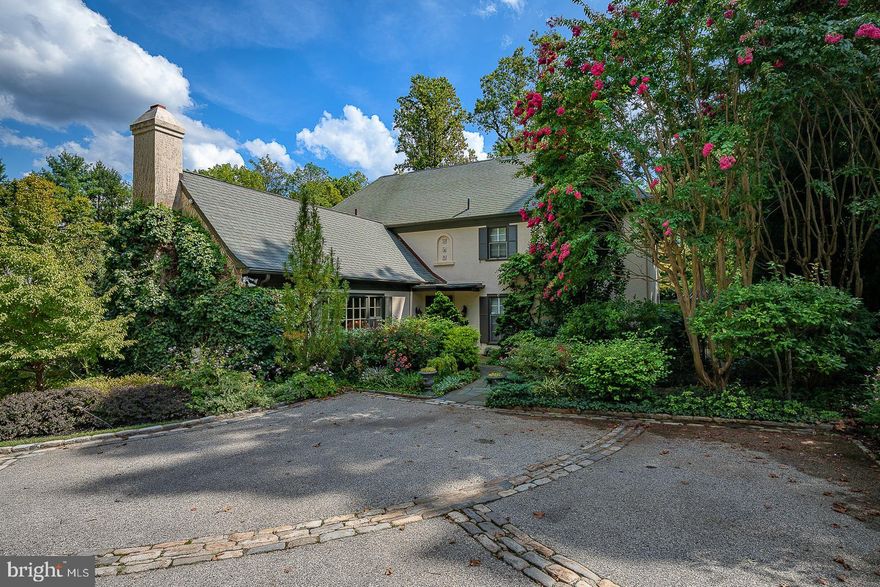 Northside Haverford, an enchanting four bedroom colonial that has been tastefully and thoroughly updated in 2007 and offers every convenience, with a universal, modern floorplan and scale for any phase of life or lifestyle. Cobbled semi-circular drive with mature plantings has ample parking court and leads to a two car attached, heated garage. Private and level fenced rear yard has flagstone patio with brick accents and covered, dining cupola; garden potting shed at the back. Solarium has large, bright sliding doors that open onto this back patio for gracious ingress/egress from the house. Superior location on a quiet, elegant street in a neighborhood of stately, beautiful houses settled among mature trees.

Winding stone path to covered front portico through English Garden. Front door opens into 16', two story entrance foyer with tile floor, double coat closets and powder room. Foyer floor plan opens to the formal living room, the kitchen and family room and the dining room / solarium . Elegant iron rail and staircase to second floor. Hallway passage from foyer to the private, optional first floor owner's suite.  Suite has pretty hardwood floors and full bath with tile floor, twin bowl vanities and rimless shower.  Walk-in closet and additional hall closets within this suite for true, one level living.

Second floor hosts three bedrooms, each with en-suite full bathrooms, large closets and bright windows. The current owner's bedroom suite on this upper level is configured of two separate bedrooms, each with its own lavishly updated bathroom, both with hot floors. These two bedroom suites are adjoining and function as one, combined for true H/H living, but can also be used separately, with privacy doors, so each bedroom would have its own private access to the hall landing and stairs.

The heart of this house is its Plain&Fancy custom kitchen, which opens beautifully through a parabolic wooden trimmed archway to a cozy family room addition. Kitchen has professional SS Viking appliance package, including gas, 36" range / oven under lit vent hood and tile backsplash. Large granite island has pendant lighting and lower storage cabinets with barstool seating. Double sinks under window for views and light. Ample granite countertops surround kitchen. Separate wetbar sink for all day service for either coffee and/or cocktails. Family room off kitchen has corner, gas FP with built-in shelves and lower cabinets, TV area with ample seating  to watch the game, or read by the fire. Window bench seats and corner office nook with more custom built-ins. Statement recessed lighting. Behind the kitchen is another open, tiled working area connecting a second, private WFH office and a kitchen laundry room w /utility sink.  Doors to both the garage and to the back door w steps down to drive . This rear, working space also connects to the vaulted solarium that opens to patio.

Moments away on foot from Haverford SEPTA railway station, Haverford Square, The Haverford School, Haverford College and Arboretum and of course, MCC, Green Engine Coffee, White Dog Cafe and Tous Les Jours bakery.