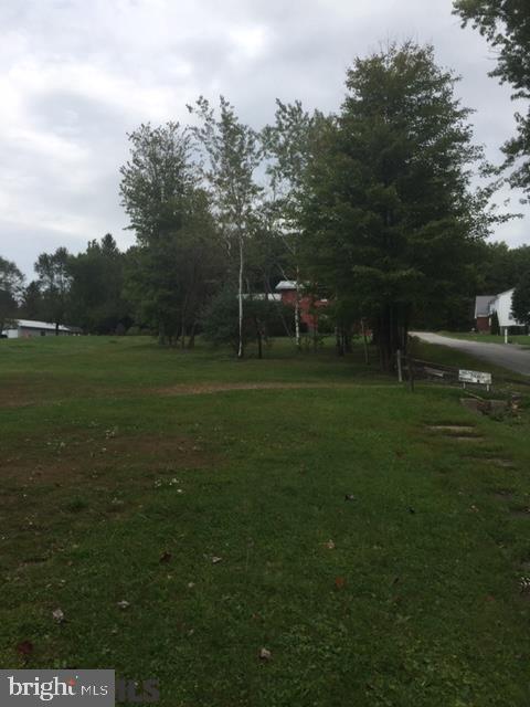 Beautiful vacant corner lot. Neighboring lot is vacant and owned by borough. Public water and sewage at road - Perfect for mobile home or small bungalow.