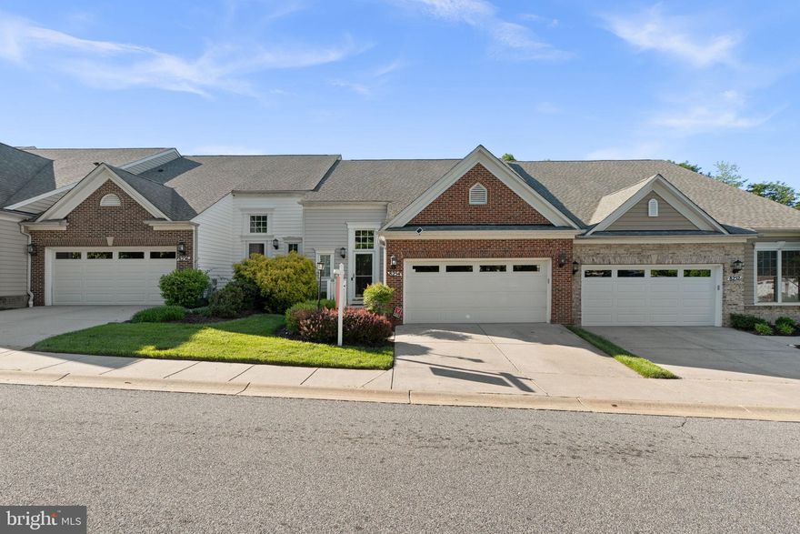 Welcome to this beautiful 4-bedroom townhome located in the highly desirable 55+ community of Village Crest, offering elegant finishes, spacious living areas, and exceptional community amenities. Thoughtful architectural details including crown molding and paneled lower walls add timeless charm throughout the home, while gorgeous hardwood floors flow across the main level.


The pretty kitchen features granite countertops, pantry storage, and breakfast bar seating, opening to a warm and inviting family room with a cozy gas fireplace. Just beyond, the bright breakfast room/sunroom provides direct access to an enclosed porch complete with its own electric fireplace—perfect for relaxing year-round.


The convenient main-level owner's suite offers comfort and privacy with an ensuite bathroom featuring a double sink vanity, a walk-in tub, and separate shower. A half bath and laundry room on the main level add to the ease of everyday living.


Upstairs, a spacious loft overlooks the foyer and is accompanied by two generously sized bedrooms and a full bathroom—ideal for guests or additional living space.


The finished lower level offers incredible flexibility with a large recreation area perfect for a home gym, media room, or hobby space, along with a fourth bedroom and full bathroom. A door from the lower level leads to a beautiful partially covered patio for additional outdoor enjoyment.


Additional highlights include a 2-car garage and a premium location backing to open space with plentiful overflow and guest parking nearby. Residents of Village Crest enjoy outstanding amenities including indoor and outdoor pools, tennis and pickleball courts, fitness center, and an activity-filled clubhouse, creating a vibrant and active lifestyle community.