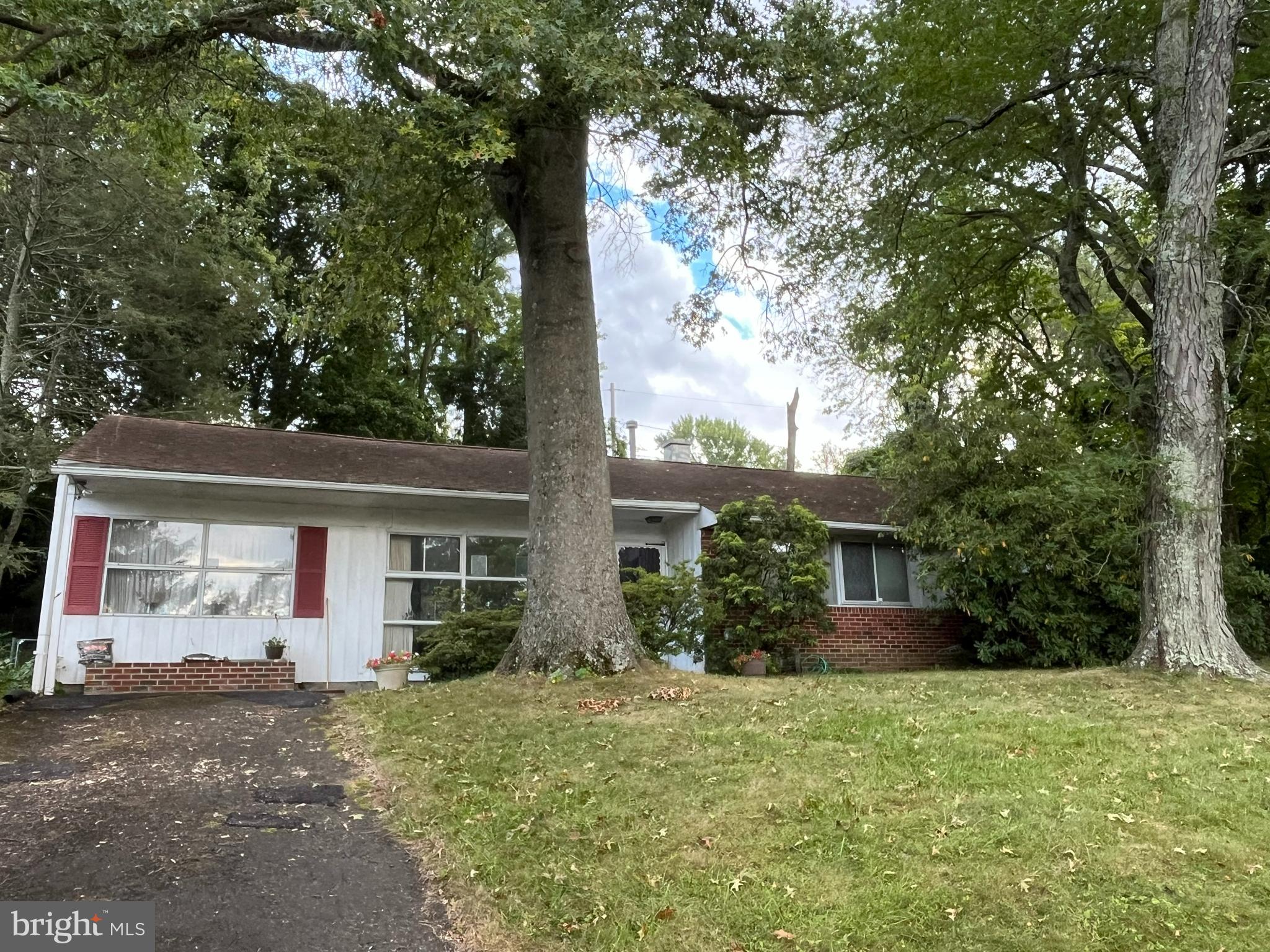 This California-style rancher won’t last long at this price! Perched on a hill in the highly sought-after Rolling Hills section of Wyndmoor, this charming home is full of potential and ready for your personal touches. The location is fantastic—just a short walk to the library and minutes from Chestnut Hill, the Turnpike, and more.
As you enter, you’re welcomed by flagstone tile that sets the tone for the home. The spacious great room is a true centerpiece, filled with natural light from oversized picture windows in the front and back, offering sweeping views of the lush yard and patio.
The light-filled kitchen features newer luxury vinyl plank flooring and direct access to the patio, making entertaining seamless. From here, you can flow easily into the great room or head toward the private bedroom wing. This wing includes generously sized bedrooms, 2 full baths, and laminate flooring in the hall and two of the rooms—all tucked away from the main living spaces for extra peace and quiet.
On the opposite side of the home, past the great room, you’ll find a versatile den/TV room with large front windows—perfect for movie nights, reading, or family game time. Toward the back of the home, a conveniently large laundry room provides additional access to the expansive patio as well as plenty of storage space. Imagine sipping your morning coffee on the patio or in your great room, while overlooking the large backyard, ideal for relaxing or entertaining.
With its unbeatable location, top-rated schools, and endless potential, this Wyndmoor gem is a true opportunity. Don’t miss it!