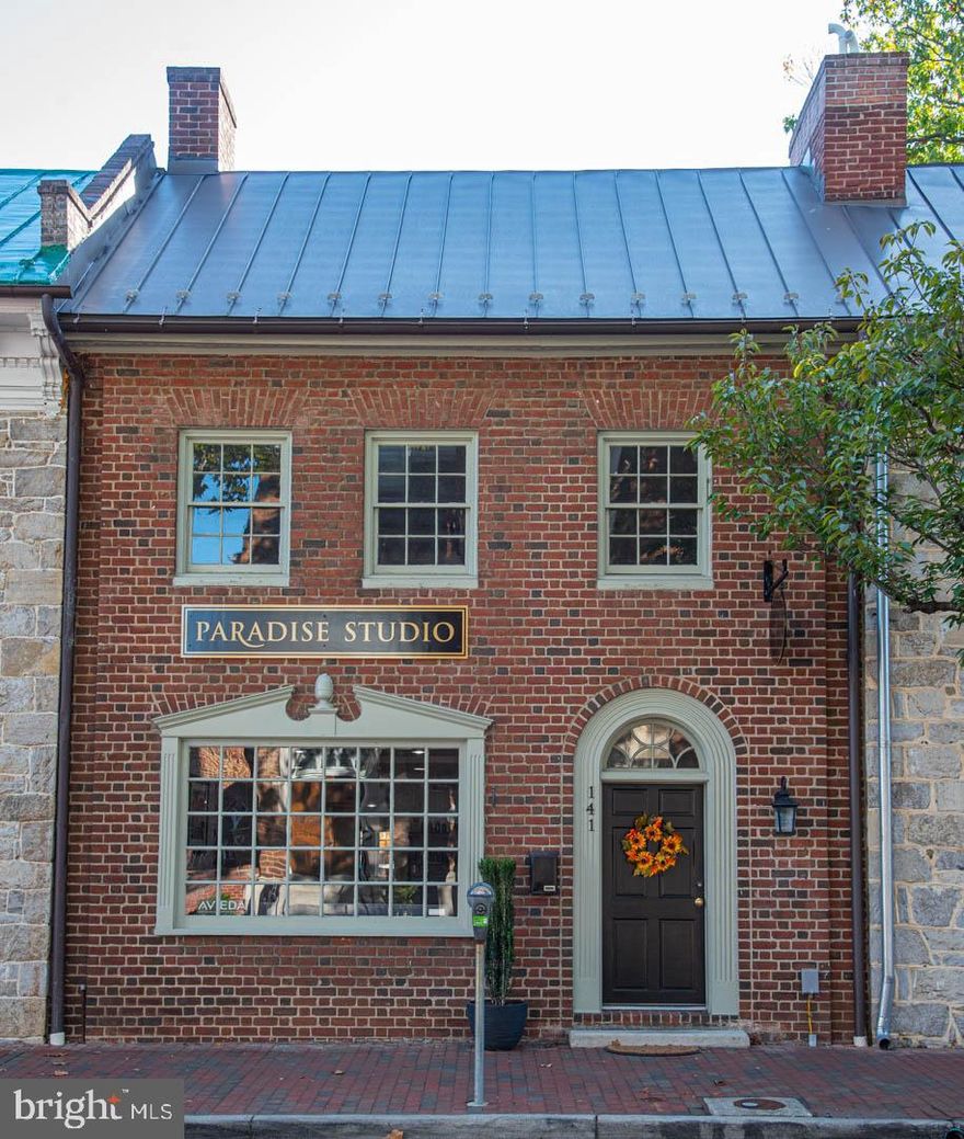 Charming historic building with  turn key hair salon business. 1-1/2 blocks from the walking mall  in exclusive downtown neighborhood. Space for 5 stylists, 2 large seating areas with upscale furnishings. Separate reception room, backbar and renovated powder room . Spacious retail floor for product sales. Backbar workspace area with shelving, seating and two refrigerators and microwave. New full size washer and dryer. Work utility sink.