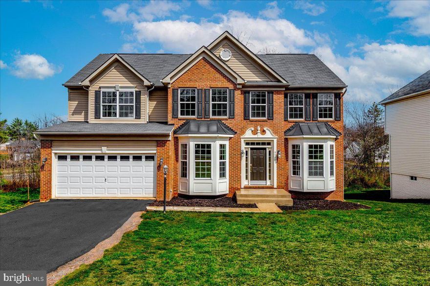 This beautiful brick-front home offers 5 bedrooms and 3.5 baths, designed for both comfort and style. The foyer opens to two rooms on either side before leading into a spacious living room, creating a seamless flow throughout the main level. The main floor also features a spacious study, a chef’s kitchen with hardwood flooring, granite countertops, and a morning room off the breakfast nook. The finished walkout basement, complete with French doors, provides additional living space and flexibility. A two-car garage, along with a driveway that accommodates up to six vehicles, ensures ample parking.