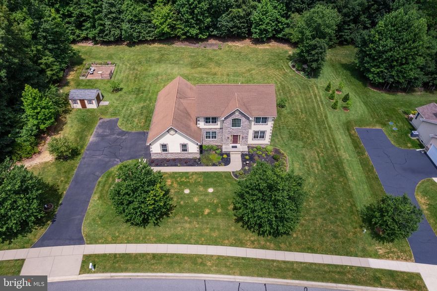 There's no place like home! Pride of ownership shows in this beautiful home on over an acre featuring 5-bedrooms in the sought after community of the Estates at Autumn Woods. The main level provides an open floor plan with hardwood floors throughout, connecting the dining room, living room, and eat-in kitchen featuring granite countertops and plenty of cabinet space. Off the kitchen, the family room offers a cozy feel with a gas fireplace. The primary suite on the main level includes vaulted ceilings, a walk-in closet, and a private bathroom with a dual vanity and both a jetted tub and walk-in shower. Upstairs, there are four spacious bedrooms and two full bathrooms. The finished basement offers extra living space, walk-out doors to the side-yard, and a large unfinished area for utilities and storage. Enjoy the outdoors on the spacious composite deck or the charming brick patio with built-in fire pit. The property also includes a 2-car garage and a storage shed for your convenience. Additional features include a full house generator and tankless hot water heater. Experience this stunning home in the serene beauty of the surrounding area, located close to Elk Neck State Park and both the Elk and North East Rivers, and only a 10-minute drive to the charming downtown North East, where local shops and restaurants await. Don’t miss out on this exquisite property!