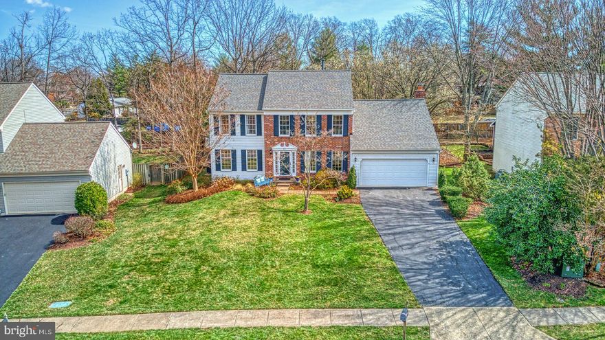 OPEN HOUSE HAS BEEN CANCELLED.  This postcard Center Hall Colonial built by Ferguson and Flynn is the perfect blend of past charm and modern elegance.  With a versatile layout, comfort, sophistication, and plenty of room to grow – this almost 4000 Sq Ft home with its impressive room sizes, a distinctive *Screened-in Porch with outdoor speakers along with a *Deck, a fenced-in rear yard with a *hot Tub and a *Pond beloved by birds, is the perfect abode to work, learn, entertain, and relax.  
Main level layout offers *Porcelain tile which expands from the foyer to the entirety of the kitchen - Installation of these tiles took 3 days just to match the grain of the design.    
Just off the Foyer – is your Office, which affords you complete privacy (sellers currently uses this space as a music room).   
The expansive eat-in *Kitchen is incredibly warm and inviting with a Bay Window, a center Island, sage-green painted Cabinets, Corian countertop, under cabinet Lighting, Pantry, and subway Backsplash.  
The family room with *Somerset red oak Wood flooring, *2 Skylights, a raised hearth brick wood-burning Fireplace is the ideal setting to watch TV and curl up - Oh! and the seller have provided the TV for your convenience.  
Classic accents such as Crown molding and Chair Railing adorn the dining and living room.  A recurring theme throughout this home is the natural light.   And that is the highlight of the living room, as well with its 3 large Windows.  The elegant dining room overlooks the beautifully landscaped back yard and manicured lawn.  
Completing the main level is a fully *Updated half bath and Laundry room.   Do note that the 2-car garage comes both with a ceiling fan and a heating system!
Transitioning to the upper level, you will find four spacious *Bedrooms with updated baths. The sizeable Primary Bedroom is truly a sanctuary and flaunts a *Custom walk-in Closet, an *en-suite Bath with Porcelain tile floors, air-jet Tub, Frameless shower w/body spray, Warming towel holder and Skylight with programmable blinds. 
Lower Level features a recreation room with a 100” screen and a home theatre projector that conveys with the home – You are welcome!    The unfinished space has storage area and even a workshop along with rough-in plumbing for a bath.  
*Denotes updates.  A exhaustive  list of updates has been uploaded to the document portal which happens to include a new roof (2018) with 10-year limited warranty, hot water heater (2016).  As noted by the builder: windows are Anderson; R-38 ceiling insulation; Copper water lines & Six-panel colonial doors.