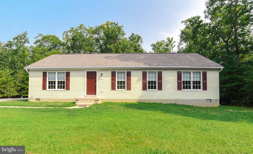 This 3 Bedroom Home has 2 Full Baths, Kitchen, Laundry, Family Room and Dining Room.  Brand New Refrigerator, Microwave, Dishwasher and Range.  New Laminate  Plank Flooring throughout. This home has Approximately 1512 SF.  It is located on Approximately 9.58 Acres.  All Paperwork, Plat and Road Maintenance Agreement are Located under Docs.