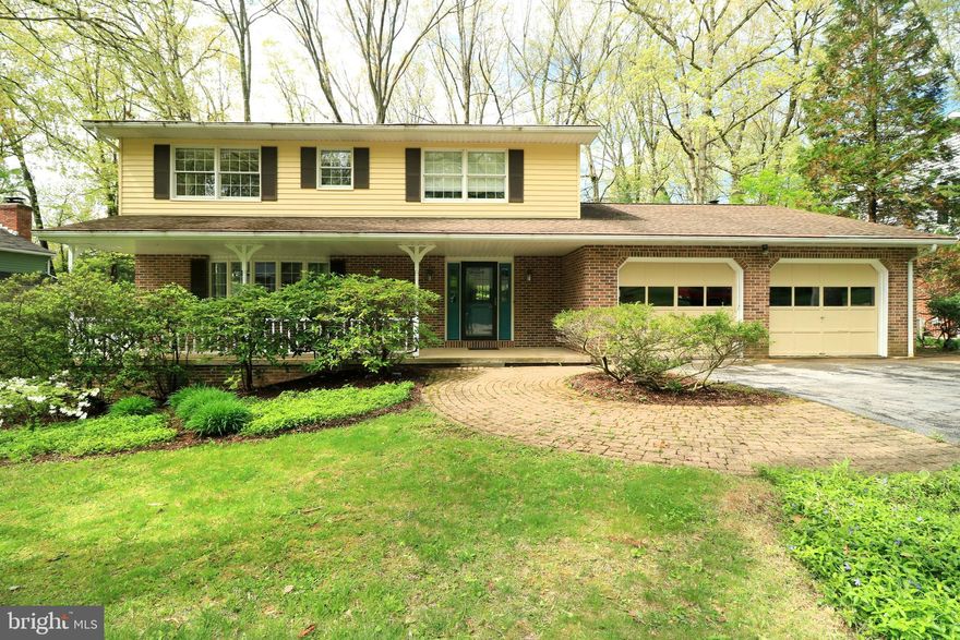 Lovely on Lanceshire!  This move-in ready, Basalla-built colonial rests on a quiet street in desirable Park Forest.  Be greeted by the inviting front porch and enter through the new front door into a welcoming foyer where you'll notice expansive bamboo flooring throughout much of the house.  Generous room sizes, plentiful windows, and an easy-living floor plan are hallmarks of this beautiful home.  The large front living room with its wide bow window is a great spot for relaxing or chatting while taking in the neighborhood view.  Entertaining is a delight in the sizable dining room with its crown molding and chair rail accents and in the spacious rear family room boasting a wall of windows with plentiful natural light and a brick hearth with a gas fireplace.  Create delectable delights in the well-appointed and sizable kitchen featuring an abundance of cabinets and quartz countertops, a tile backsplash, stainless steel appliances, a desk area, and breakfast bar.  A classic, timeless banister leads you to the second floor where you'll find four ample sized bedrooms, all with bamboo flooring.  The large primary suite boasts a large walk-in closet and a nicely updated bath, as well as three windows providing wonderful natural light.  Have fun in the lower level family room which features a cozy gas fireplace, get your crafting on in the oversized laundry room, or get your workout on in the gym area, which has a walk-out to the backyard.  Offering privacy with its mature trees and plantings, a sprawling two-tier deck, and a fenced-in backyard you'll find lots of ways to relax on the deck and enjoy the yard.  Other features include an ample two car garage and a newer heat pump with central air.  A very walkable neighborhood, you'll appreciate the many sidewalks, bike paths, parks, schools, restaurants & shops, and the community pool all within a short distance.  Tucked away on a quiet street, yet minutes from downtown State College and Penn State make this the perfect spot to call home!