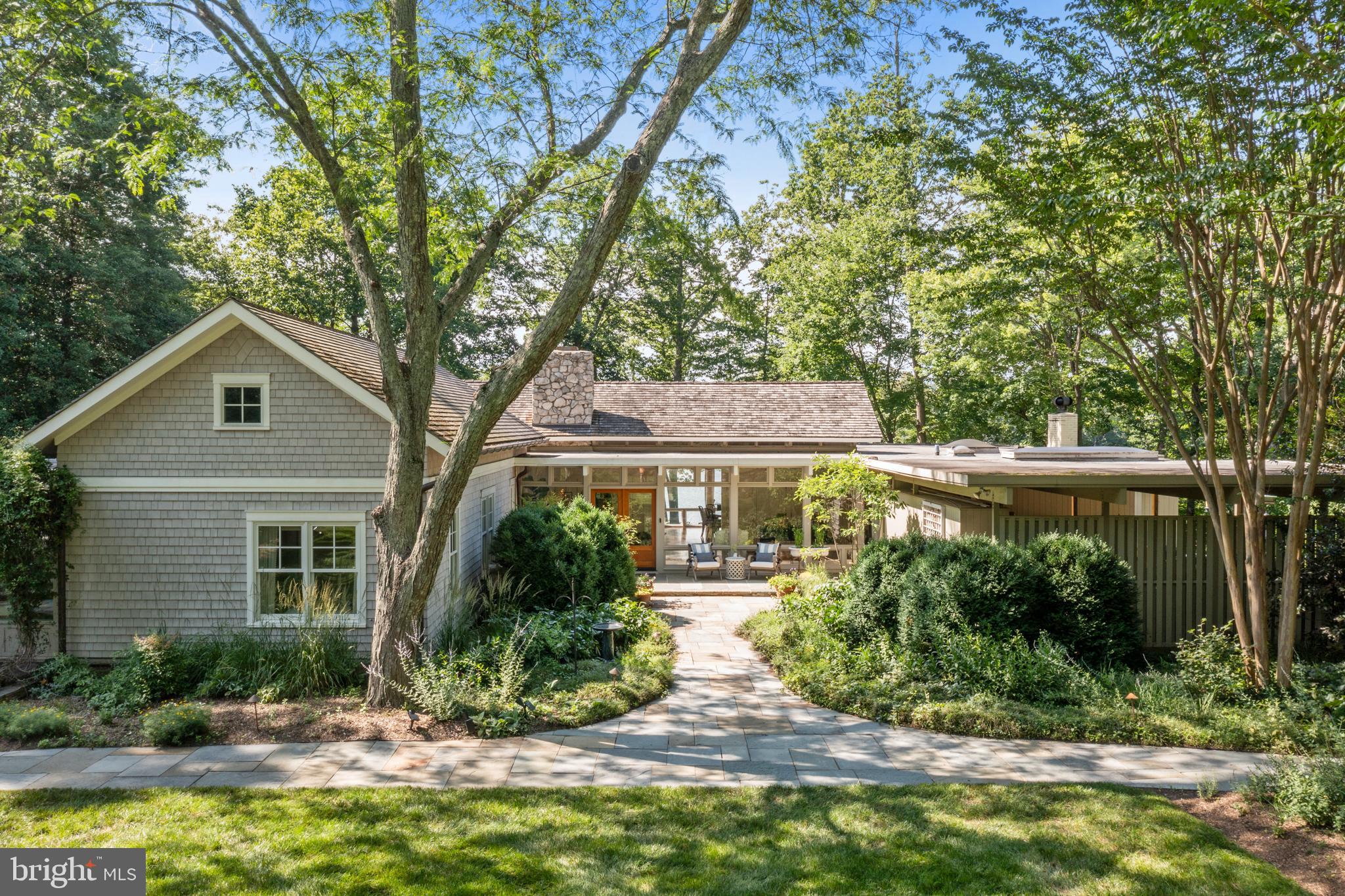 Welcome to 917 Arbutus Road—an extraordinary waterfront property nestled on 5 private acres with deep water on Crab Creek minutes from downtown Annapolis. This mid-century modern home offers over 3656 SF of light-filled living space, with soaring ceilings, expansive glass walls, and panoramic views of water and nature. The main level boasts four bedrooms and open-concept living areas designed for both comfort and entertaining. Enjoy sunsets from the oversized deck or relax by the heated saltwater pool and a charming private guest/pool house with an additional 470 feet comfortable living space. Boaters will appreciate the deep-water at the pier (10 ft MLW), the 300+ feet of frontage and the direct access to the South River and Chesapeake Bay. A large barn offers endless possibilities—perfect as a workshop, recreation space, or artist studio. Located just minutes from downtown Annapolis yet tucked away in complete privacy, this is a rare opportunity to own a legacy property with timeless appeal and modern amenities. Property in need of some renovations. Two adjacent additional lots (one waterfront) are available for sale. LOT 1R, a 1.88 acres waterfront lot with 104.01 ft of water frontage Tax ID: 020200007365075) for $1,750,000 and LOT 2: 1.52 acres - (Tax ID: 020200090231514) for $700,000. Lots will not be sold prior to sale of the main house on the 5 acres lot.