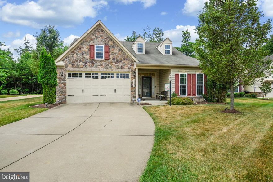 This home, located in the premium, and well sort after 55+ community of Central Parke at Colonial Charles in Waldorf, MD.  If you’re scaling down your home size and all the upkeep that goes with it, look no further than this community.  Exterior grounds, including shrubs, and common area are maintained by the grounds maintenance crews, are all included in the HOA monthly fee.
 
There is so much, more, including a grand Clubhouse with patio and an interior and exterior pool.  Additionally, the Clubhouse features a ballroom, billiards, and game room, along with exercise facilities and equipment, sauna, meeting rooms, full kitchen with food prepping space for meetings or for hosting your own social events.
 
This home is designed for the 55+ community featuring larger main entry and room doors to accommodate possible physical challenges, great flow of natural lighting, contemporary open floor plan, solarium with sliding glass door, hardwood floors throughout, office(s) (one bedroom flexed to accommodate as an office), sizeable owner’s suite with illuminating lighted tray ceiling doubled vanity and sizeable walk-in shower, soaking tub, and water closet.  The suite includes an adjoining light-filled sitting room with access to the stone patio enclosed by a low and tasteful picket-fenced backyard. With the home backing to trees, it is reassuring to know the trees are registered and protected by a County Conservancy Easement.
 
Have I mentioned the large open gourmet kitchen with recessed lighting and a large granite top island and counter space.  The gas cook-top and hood with stainless steel appliances, which adds to the additional flow and accommodation for guests as they move throughout the open space during entertaining. 
 
The flexed upper-level bedroom that was converted to a media, game room and bonus room, with theater surround sound for your audio pleasure and enjoyment, comfortable home theater seating and full bath on this level.
 
This unique home has all the upgrades required by any distinguished buyer to include a whole-house water purification system and water softener feature, as well as a whole house UV Light Air Purification System which purifies all outside air that enters the house through the air handler.  This home is a must-see! Schedule your appointment today.