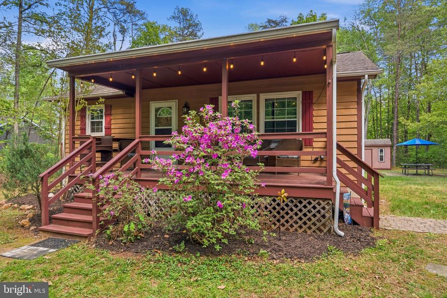 This charming cottage in Pine Harbour on Lake Anna's public side is perfect for your full-time living or adventurous getaway. With 2 bedrooms, 1 bathroom, and an open kitchen and living room concept, this home is sure to impress. Upgraded kitchen with maple cabinetry, new lighting, and granite top island as well! This home has newer LVP flooring, windows, doors, roof, and a shed! This home comes with all of its furnishings to make it move-in ready. Pine Harbour, a gated community, is very convenient to restaurants, grocery stores, veterinarians, and more! Come bring your rocking chairs for the covered front porch and enjoy lake living!