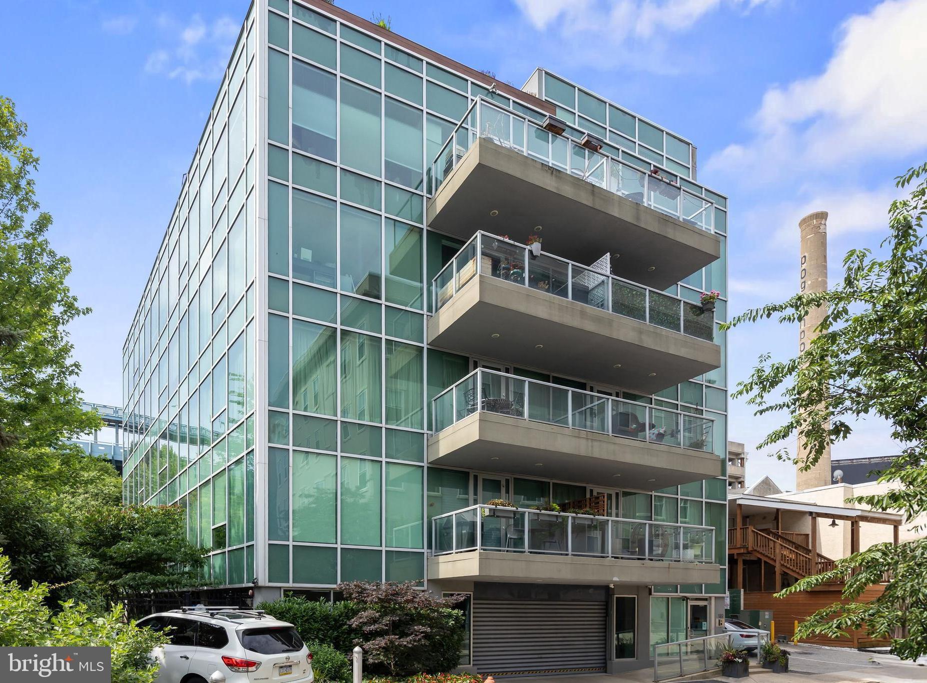 Nestled in a serene Old City enclave, this two-bedroom, two-bathroom unit with 1-car deeded parking in the 16-unit NOUVEAU Condominium marries the historic charm of Old City with the ultimate in modern luxury. Floor-to-ceiling, Solutia soundproof windows with tree top views and custom solar shades flood the open living and dining area—anchored by a sleek gas fireplace. Ten-foot ceilings soar above wide-plank hardwood floors throughout, while a chef’s kitchen featuring Poggenpohl cabinets, black granite countertops, stainless-steel Miele double ovens, gas cooktop, dishwasher, and Liebherr/Sub-Zero refrigeration. Retreat to your oversized primary suite, complete with a spa-inspired en-suite featuring Dornbracht and Duravit fixtures, 24″ porcelain tile, a deep soaking tub and frameless-glass shower. Both bedrooms offer custom closet organizers, and an in-unit utility room—with tankless hot-water heater, front-loading washer/dryer and abundant storage—ensures everyday convenience. The listing price is inclusive of self-park, deeded garage parking, secure video-monitored intercom access, elevator service, and professionally maintained common areas including a zen-like interior courtyard. Unit 2C delivers the premier value in Old City living- steps from local favorites: Riverwards Produce, Cafe Zeit, Cafe Ole, Tuna Bar, Almost Home General, all of the sought after boutiques on 3rd street...and don't forget the amazing history of Old City hidden around every corner (like Elfreth's Alley!). Easy access to both 95, 676 as well as public transportation make The Nouveau a commuter's dream.