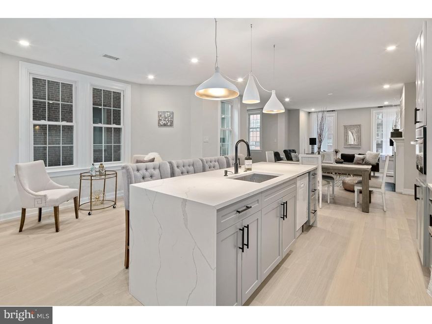 Custom renovation in the Heart of Washington Square West with up to 2-car parking, a fireplace, almost 2400 square feet and some of the coolest luxury finishes in town! Classic brownstone building with elevator and architectural details throughout!! Brand new Kitchen with sleek cabinetry, Super high end Bertazzoni appliances, quartz counters with huge Island with waterfall edges. Tall ceiling heights, custom closets throughout. many windows throughout the property  that drench the unit with sunlight, extra large living room with lots of extra space that accommodate multiple seating areas. Large dining area, kitchen table location and huge island, lots of space in this home!!! Stunning master suite that takes up an entire floor. Master bath has glass shower doors, custom tile floor and shower walls, floating double vanity with illuminated his and hers designer mirrors. The master bedroom has several walk in closets with custom shelving, and an exterior DECK off of the bedroom.  This is a magnificent unit and larger than most homes in the neighborhood!! Full laundry room with full sized washer and dryer. lots of storage in this home.The Stately marble steps and columns enhance the brick and stone facade, tree lined block and a location walk-able to Pennsylvania hospital, Washington Square Park, Broad street, Jefferson, and dozens of world class restaurants, boutiques and attractions. Low taxes and low monthly condo fees. One parking space is included in the sale. The second PARKING spot is for sale for 60k and not included in the sale price. Check OPA for 2019 taxes due to possible citywide reassessment.Square footage total includes above grade space and below grade space and is estimated