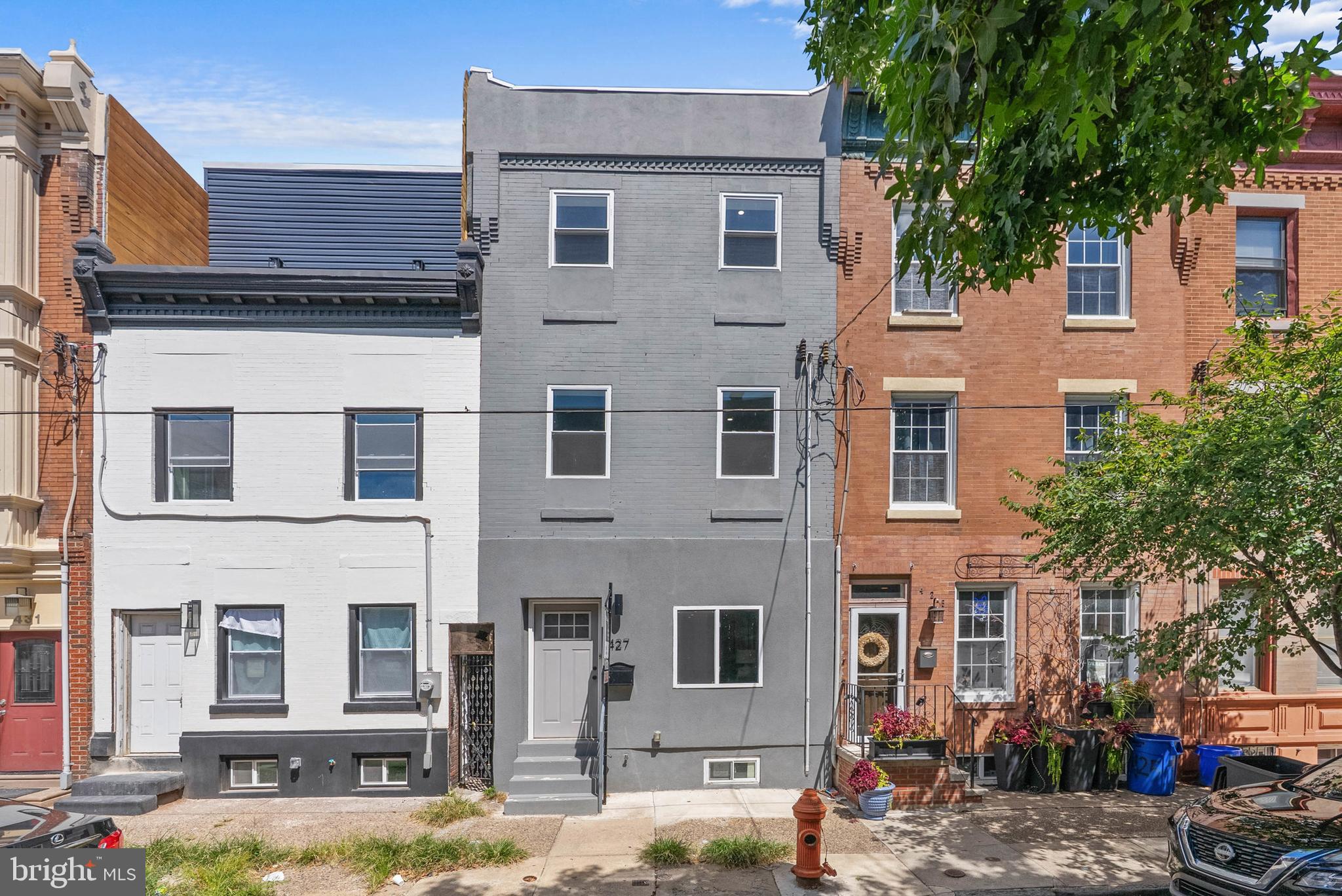 Another Newly redone property by L&W builders. This is a large sun filled 3 story, 4 bedrooms, 2.5 baths, with a finished basement house in Dickinson Narrows just steps to the Dickinson Square Park. 1st floor - enter into an open floor plan living room space with custom built floating stairs, dining area, a beautiful chef's galley style kitchen with white quartz countertops, subway tiles, farmer's sink, s/s appliances and a 1/2 bath before entrance to a small back patio. 2nd floor - Spacious front bedroom with 2 closets, washer/dryer closet, large 3 piece full bath with custom tiling, and a decent size rear bedroom with closet. 3rd floor - Rear bedroom with a small closet that can be used as an office space/playroom. Front main bedroom with 2 closets, large main bathroom with double bowl sinks and large walk in shower with 2 shower heads and custom tiling. This is a great bang for the buck in an awesome neighborhood. Close to Moonshine Tavern, Grindcore House, Herman's Coffee, Jaxx Steak Taproom, Gooey Looies, Pennsport Beer Boutique and other establishments. Easy to show!
