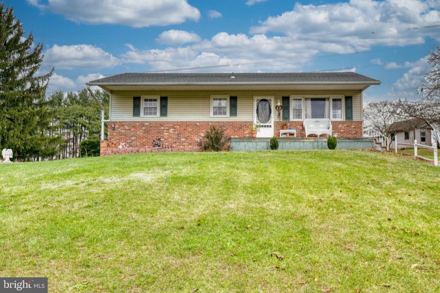 Welcome to 4915 Oriole Court in Westminster.   This home has been lovingly cared for by its original owners, and the time has come to pass it along to new stewards.  An ample sized three-bedroom one-bath brick ranch style home on a cul-de-sac lot overlooks a pond in the front, and open space in the back.  You may feel as though you never want to leave home.  The home features a front porch which is the ideal place to have your morning coffee or afternoon tea while enjoying the view of the pond.  A warm entryway leads you into a spacious living room with rich colored wood like laminate flooring, and large windows which fill the room with an abundance of warmth and sunlight.  Off of the living room is a spacious eat in white county kitchen with plenty of room to cook and entertain.   There are glass doors off of the eat in kitchen for you to look at the wildlife and access the backyard.  Three nice sized bedrooms and a full bath complete the main level.  Down the steps into the lower level, you will find a full basement that has been partially finished and features a large plush carpeted entertainment area, a workshop room, a utility room. laundry area and an additional room that could serve as a fourth bedroom, study or hobby room.   The property features 2 charming sheds that offer great storage space. There are no HOA restrictions.  This is an AS IS sale.  Seller will make no repairs.