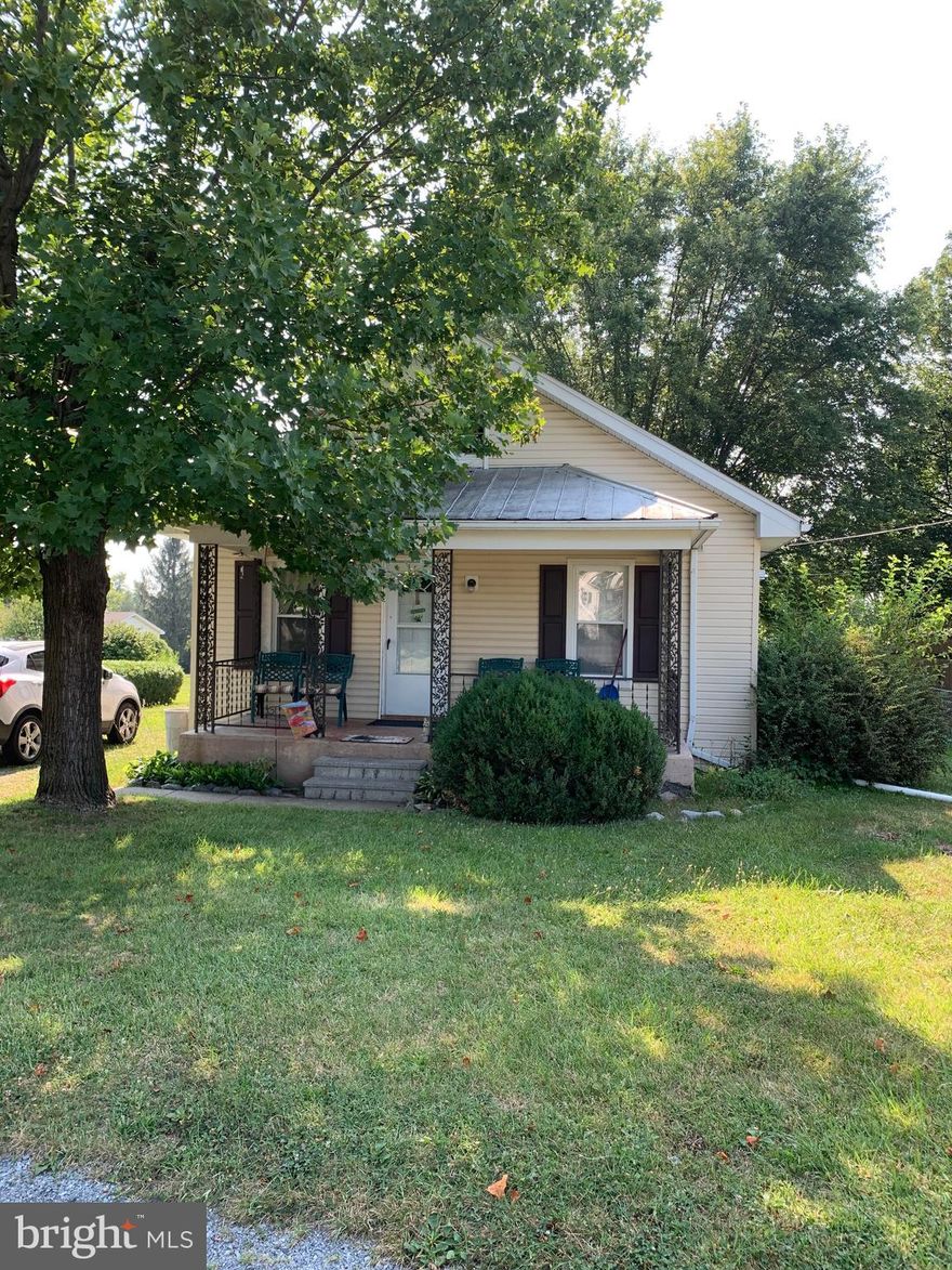 This cute home sits in the central part of Martinsburg and is close to schools, shopping, and  for commuting.  This home features 3 bedrooms and 2 baths, hardwood floors, stainless steel appliances, along with a nice backyard for entertaining , or just enjoying the day.  This home also has a clothes line in which to hang your clothes.  Great home for a first time buyer or even a buyer who needs to scale down.  Nice front porch also to sit on to relax.  This home also features 3 sheds for storage or work area.  Don't let this one pass you by.