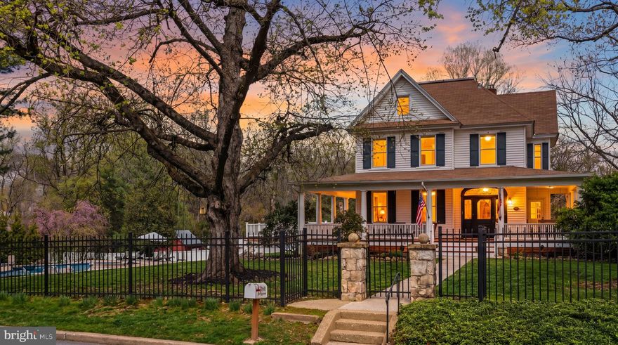 A rare opportunity to own your own slice of history. Glyndon's historic district boasts homes initially built for wealthy families who would take their summers in Glyndon, the furthest train stop out of Baltimore at the time. They escaped the city heat to the countryside and slowly developed Glyndon into a neighborhood that residents still enjoy with the foundation of community and a love of the warmer months at its core, to this day. Of the 115 historic homes in the neighborhood, only 23 have a footprint over 3,000 sq ft, and a handful have been fully renovated, making 2 Waugh Ave a sought-after property for those seeking a home that has lovingly preserved the history and charm of a home built in 1892 with all of the modern upgrades that make living and hosting seamless.

The property is ideally situated on the corner of Waugh Ave, the original road leading to famed Emory Grove and Butler Road, the heart of the neighborhood. Facing Waugh with the yard behind it, this corner lot is just shy of an acre, ideal for families with kids or dogs who love a generous, flat, fenced-in yard to enjoy. The back of the home has an oversized deck overlooking the heated saltwater pool and hot tub, perfect for grilling, dining al fresco and entertaining.

The wrap-around porch invites you to linger and say hello to neighbors as they stroll by walking their dogs, enjoying the quiet street. The main level has refinished original hardwoods leading to a spacious family room with original pocket doors. Behind that find a den with a built in bar and wood burning fire place and a dining room. The kitchen is open and well appointed with white cabintery, a viking range and a pantry with additional storage, coffee bar extra fridge and double oven perfect for meal prep and entertaining. A half bath completes the space.

Upstairs find three spacious bedrooms including the master en-suite, a hall bathroom and laundry room, The walk-up attic level on the third floor has an additional 3 bedrooms, one best served as an office and a full bathroom with a claw foot tub as well as oversized closet spaces perfect for storage. The basement is unfinished and perfect for storage. Under the deck, find a 2 car garage with glass front doors currently used as storage. The off-street parking pad easily parks 4 cars.

2 zone HVAC is 11 years old, Roof 11 years old, All pool equipment is in great working order (ages of updates and records available), Windows, siding and gutters have already been replaced so there are no additional updates needed to go through the historic committee.

Living in Glyndon is like taking a step back in time. The community is active with the Historic Glyndon committee, the Glyndon Community Association and Emory Grove at the end of Waugh Ave. Welcome to your own personal Hallmark Movie!