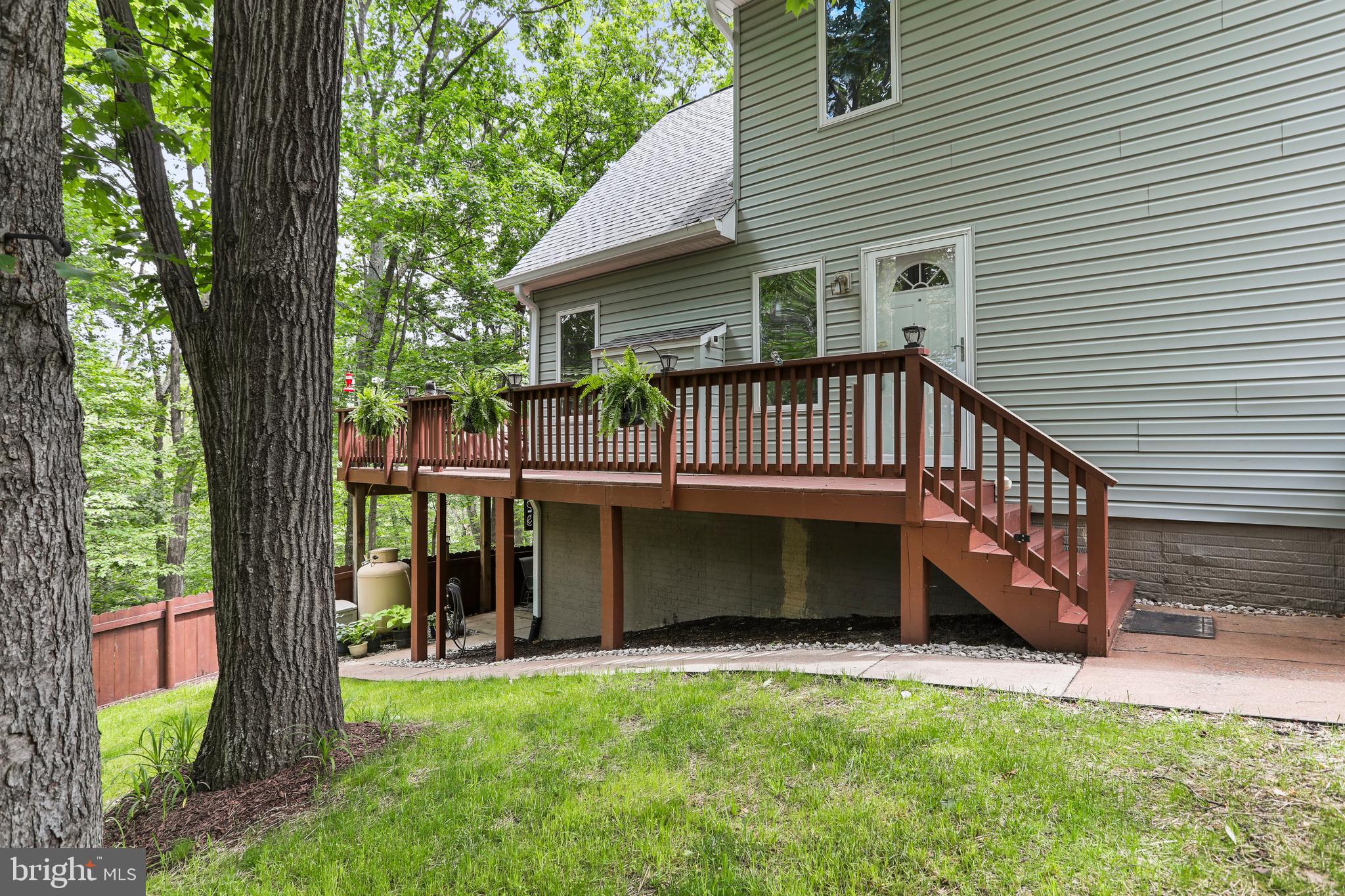 This well-maintained Chalet-style home is nestled on a wooded 1.01-acre homesite in The Woods, offering privacy, peace, and room to grow. Recent updates include a new roof and a freshly restained 33.5 x 10 open deck, perfect for enjoying the outdoors with friends and family.
Inside, the main living area features cathedral ceilings, a fixed glass window wall, and a gas fireplace for cozy evenings. Wood laminate flooring flows through the living room, dining area, and entry foyer. Two sliding glass doors open to the expansive deck with tranquil wooded views.
The home offers 3 bedrooms, 2 full baths, and an open loft—ideal for a home office, den, or potential 4th bedroom. The spacious primary suite includes a large walk-in closet, garden tub, double bowl vanity, and separate shower.
The unfinished walk-out lower level has rough-in plumbing for a future bathroom and offers endless possibilities for added living space. Additional features include a concrete patio, fenced-in yard, and low-maintenance vinyl siding.
A Class A membership is available with a one-time $3,150 initiation fee, granting access to the community’s amenities including golf, pools, tennis, and more.