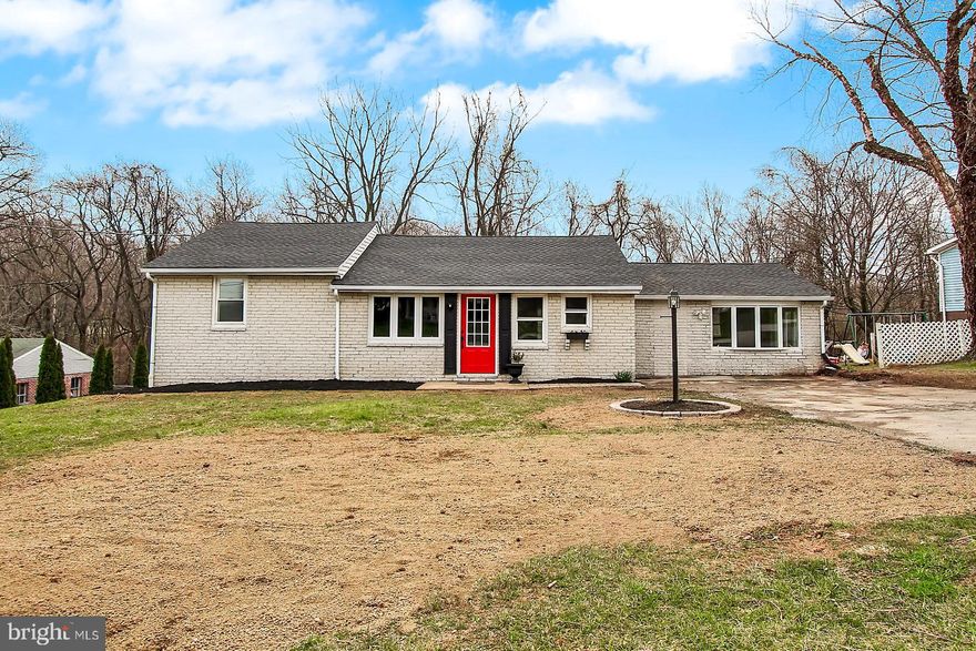 NEW, NEW, NEW! All brick rancher features new flooring throughout, new heat pump, new roof, new hot water heater, new electric and new plumbing. Granite counter tops in kitchen. Massive master bedroom could also be used as a family room.  There is a brick, propane fireplace in what could be used as dining space, a sitting room or an extension for full master suite with a covered porch to the secluded back yard area. Den/Game room in basement  could also serve as a bedroom/guest room and features french doors that walk out to a paver patio with scenic wooded views. So many options for use of space in this beauty. Come see it today!