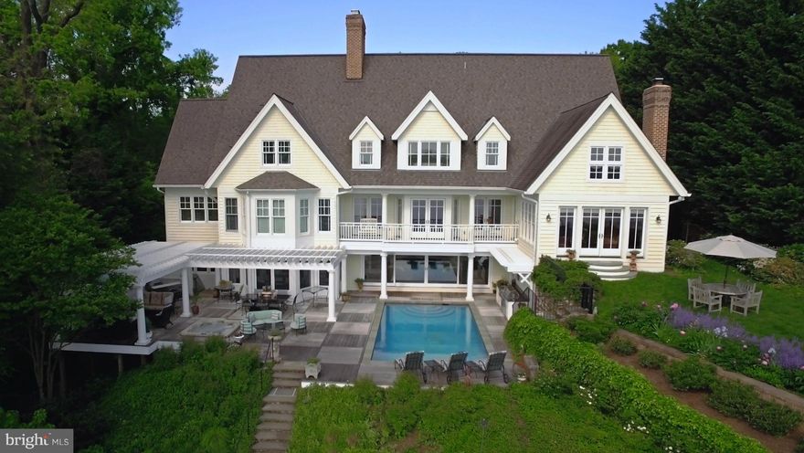 Elegant custom home w/ sweeping views of the Naval Academy &Severn River. Watch the Blue Angels by the waterside pool, hot tub, outdoor kitchen,&deep water pier w/3 lifts. No detail spared w/ lavish features throughout. Elevator, 4 fireplaces, gourmet chef's kitchen w/granite & luxury SS appliances, 2nd kitchen, heart of pine HW floors, main level master suite, theater, gym,2 offices, &huge attic.