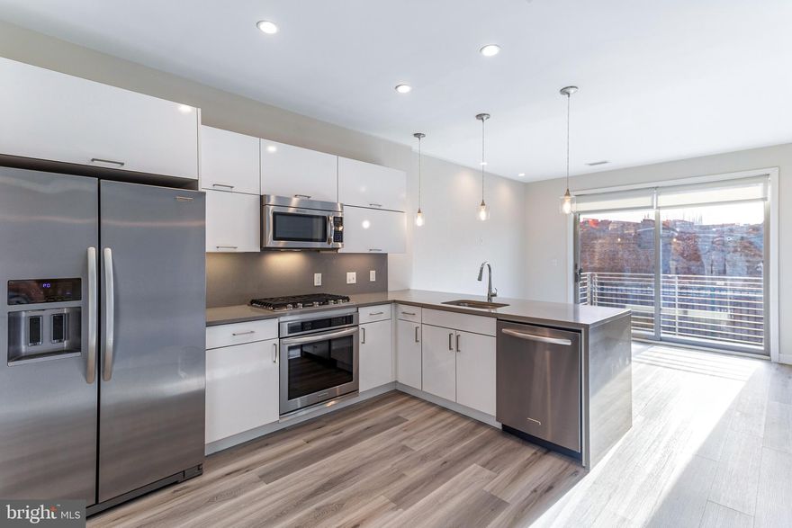 Welcome to The Maryland Condominiums, , located in the H Street Corridor!  This 2015 built, corner 1 bedroom home with den (or can be used as 2nd bedroom!).  Kitchen-Aid appliances, quartz countertops, gas cooking, full size washer/dryer & hardwood flooring throughout! Features attended front desk, package concierge system, expansive solar panel rooftop w/ gas grills & Monument & Capitol Views!  95 Walk Score! Within blocks from Whole Foods, Giant, Union Market, Starbucks, Orangetheory Fitness, CorePower Yoga, various restaurants,  Capitol Hill and much more!