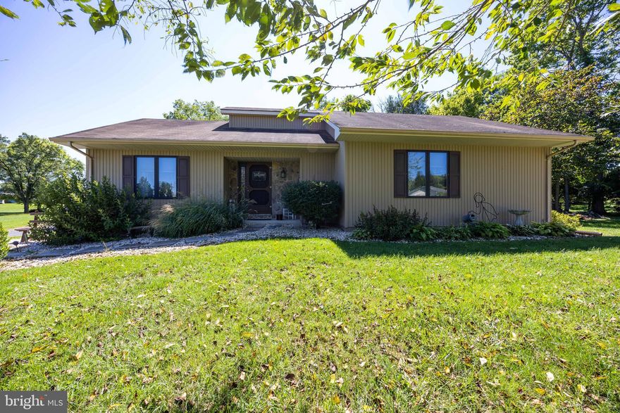 Charming One-Level Living in South Berkeley County!

Discover your new home in this well-maintained 3-bedroom, 2-bathroom rancher, perfectly set on a spacious lot in South Berkeley County with convenient access to Virginia. From the moment you arrive, you'll be captivated by the mature trees and meticulously landscaped surroundings that offer a warm and inviting curb appeal.

Step inside to a welcoming foyer that opens directly into the living room, where the open layout creates a surprisingly spacious feel. Atrium doors lead to a serene screened-in patio, offering a perfect spot to relax while overlooking a beautiful rock garden.

The generously sized dining room is perfect for hosting special occasions, with ample space for a large table and a china closet. The efficient kitchen is designed for ease and functionality, featuring wood cabinetry, an electric range, and a convenient pantry closet that makes cooking a breeze.

The primary suite is tucked away at the end of the hallway, providing a private retreat complete with an en-suite bath and a walk-in closet. The additional bedrooms are well-sized, offering versatile spaces for guests, play, or work, all with cozy carpeting for added comfort. Both bathrooms are equipped with tub/shower units and single vanities.

Outside, you'll find a detached single-car garage and a storage shed, both nestled among lush flower beds and rock gardens, enhancing the natural beauty of the property. The backyard backs to trees, creating a peaceful outdoor oasis perfect for pets, play, and relaxation.

With its thoughtful design, lovely landscaping, and desirable one-level living, this home offers a delightful blend of comfort and convenience. Come home to your perfect retreat!