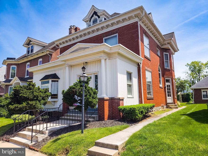 Allow your imagination to open to all of the possibilities offered by this unique and beautiful home.   You will immediately notice high ceilings and finely crafted woodwork. The first floor spacious living room features an ornate wooden staircase and lovely stain glass window. The first floor also boasts of a dining room, eat-in kitchen, large screened porch, main level laundry room and two half baths. The front room has been tastefully remodeled for use as a modern and sleek hair salon. Next you can journey to the second floor by either of the two connecting stairways. Four generous bedrooms and a full bath round out a comfortable second floor  living space.  Throughout the home you will find handsome wooden trim, original doors and several rooms which still feature original hardwood floors. To see more possibilities offered by the home, venture to the third floor. The third floor includes two additional large rooms. These rooms would easily serve as a 5th and 6th bedroom (one even includes a cedar lined closet) or as storage and hobby space. The backyard feels quaint and private despite being in the middle of town.  This home further offers the possibility of an in home business. New owners will enjoy the flexibility that this Property offers for almost any future they can imagine. Opportunities like this property are hard to find.