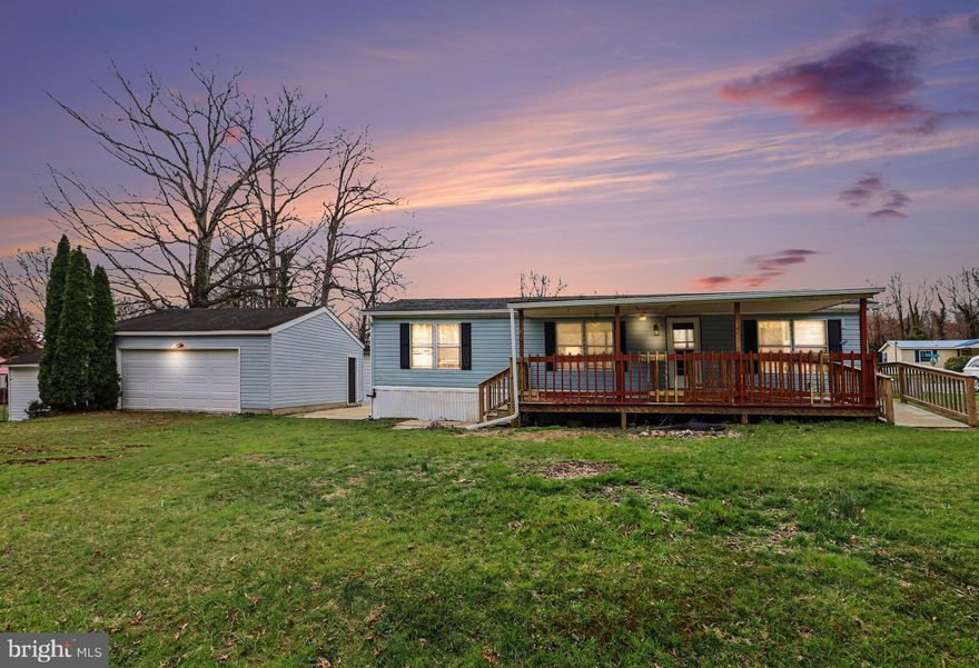 Spacious 3 bedroom, 2 bath rancher manufactured home. Two decks, one with ramp for easy access. Tucked away on a Large corner lot with 2 separate parking areas plus 2 car detached garage. Kitchen has lots of cabinets and storage with Separate laundry off kitchen with back deck access. Needs some TLC but is move in ready  NO HOA and NO GROUND RENT. Sold "AS IS"
 Master bath with walk in shower updated 2023 and ramp added 2023.  Close to shopping, 95 and Route 40.