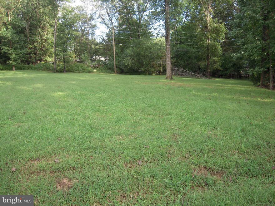 Bring your Dream Home Plans--Prime  Flat Lot. Ready to Build.Larger than most Lots in Lake of the Woods - nearly a half acre.  Cleared with lining trees Located in sort after amenity filled Lake of the Woods Gated Community, 24 hr Security, two private Lakes, PGA Golf Course, Swimming Pool, Clubhouse Restaurant, Pro Shop w/Cafe, Tennis & Pickerel Ball Courts, New Health Center under construction.