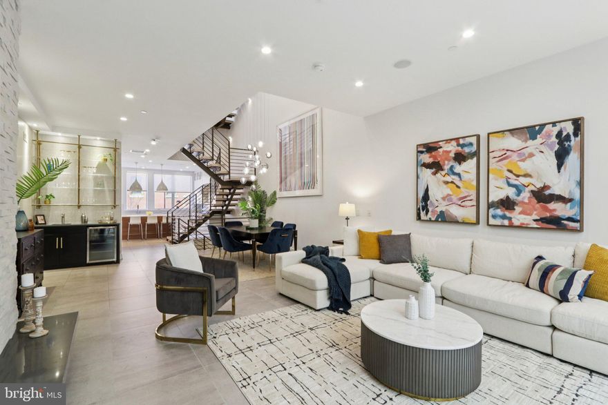 Designed by Shimi Zakin, who Philly Mag opined is the “most creative modern architect practicing in Philadelphia right now,” 207 S 22nd offers superior spaces and volume throughout a gracious Rittenhouse Square neighborhood home with over 5,000 square feet of livable space. This includes just over 3,900+ square feet, plus almost 1,000 square feet of outdoor space, intelligently sited among three different, highly functional outdoor spaces. Zakin hit a home run with this one!

This extra-wide home also offers 3-CAR PARKING—a 2-car side-by-side private garage and a 3rd secure and covered space just across from the garage. The 355 square foot garage completes the square footage noted above.

This home is not “too huge.” It is perfectly sized with gracious rooms, an ideal layout, balanced all-day light, and superb outdoor spaces.

4 bedrooms (or 3 bedrooms plus office), 4 full baths, 2 half baths, and an elegantly finished lower level that offers a family room and a den. This is not just a “basement,” rather it is seamlessly integrated as part of the home.

Not to mention the 6-stop elevator that goes from the lower level up to the spectacular roof patio with skyline views.

Imagine living space with soaring ceilings and huge windows, bathed in all-day light. A brilliant atrium and center-staircase (hardwood and steel). Stunning light fixtures. State-of-the-art systems. Tasteful finishes throughout, including many custom, artisan built-ins commissioned by the owners. Chef’s kitchen with Sub Zero and Wolf appliances, wet bar, outdoor kitchen, dream primary bed and spa bath and amazing closets! Gorgeous hardwood floors. The outdoor spaces are amazing. They include a private patio off the living area. A west-facing terrace off the primary floor. And a walk-out full-floor roof patio with skyline views.

207 S 22nd offers so much in the most convenient Rittenhouse location. Two blocks to Rittenhouse square and all the restaurants, cafes, and shops of Rittenhouse Row. Easy walk to University City, including Penn, Drexel, CHOP, HUP, and 30th Street Station. Also, a convenient walk to Midtown Village, Thomas Jefferson University, the Parkway and museums, Schuylkill River Trail, Trader Joe’s, Giant, and all of Center City. No wonder this property in the GREENFIELD SCHOOL CATCHMENT has a 99 WalkScore, 100 Transit Score, and a 98 Bike Score.

Luxury, Space, Light, Volume, 3-Car Garage Parking, Convenience, Location, and stunning outdoor space. This stellar home has it all.

NOTE--The HOA covers the common parking driveway and security gate (maintenance, insurance, etc.)