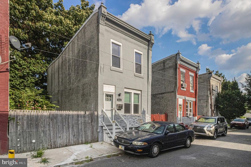 Presenting 3141 N. Percy St. This home was beautifully renovated a few years ago, and now it’s time for new owners to make their own memories in this well-lived home. Upon entering the home, you’ll be greeted with a spacious and well-lit living room with hardwood flooring that flows effortlessly into the dining room. Both rooms offer great space for relaxing and entertaining. You’ll love the color of the freshly painted walls and how the millwork pops. The remodeled kitchen offers an abundance of cabinetry and countertop space. The owner thoughtfully added additional cabinets and countertops on the opposite wall for your storage, meal prep, and entertaining needs. The laundry room adjacent to the kitchen completes the 1st floor. The washer and dryer remain with the property.  The hardwood floors continue as you go upstairs, where 3 generously sized bedrooms await. Each bedroom provides ample closet space and natural light. The cozy hall bathroom is decked out with lovely tile and a mirrored medicine cabinet. The basement offers plenty of room for storage and is well-insulated. Not many homes are wrapped with insulation. These walls can be easily framed and finished. There is a small rear yard that completes the home. While initially a row home, this home is now a fully detached property with lots on either side, making the home feel unique and special. Schedule your showing today.