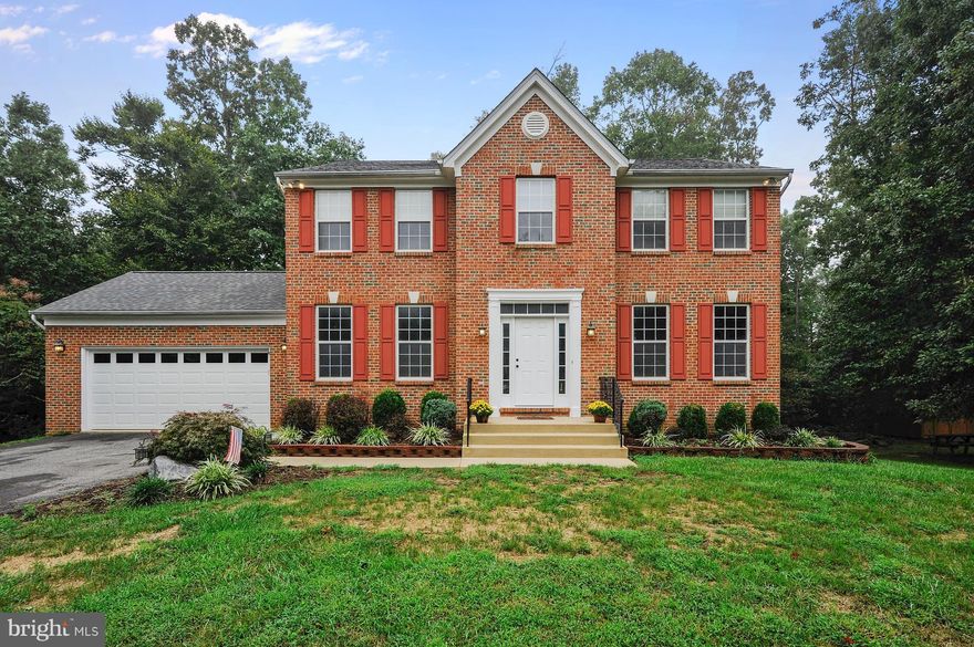 Enjoy being close to downtown La Plata, but just outside of town lines to not have the town taxes and to have a 1 acre lot!  This gorgeous 4 bedroom, 2.5 bathroom Colonial has many new and updated features!  Be welcomed by the new, bright and inviting front door and enter into the open foyer with newer hardwood laminate flooring throughout the main level.  Beautiful main living area with an eat-in kitchen, family room with recessed lighting, fireplace & french doors to deck overlooking a lush wooded backyard.  Master bedroom with vaulted ceiling, ensuite newly remodeled designer bath with double vanity, glassed shower, dressing area, linen  & walk-in closets. All three levels are equipped with Nest thermostats and smoke detectors.  New 30 year architectural shingled roof with transferable warranty. Newly resurfaced and sealed driveway.  Full, unfinished basement with walk-out, natural light and rough in that's ready for you to finish as you please!   2 car attached garage.  Beautiful, flat, partially wooded 1 acre lot. Convenient to schools, shopping, dining and commuter routes! Offering closing help!