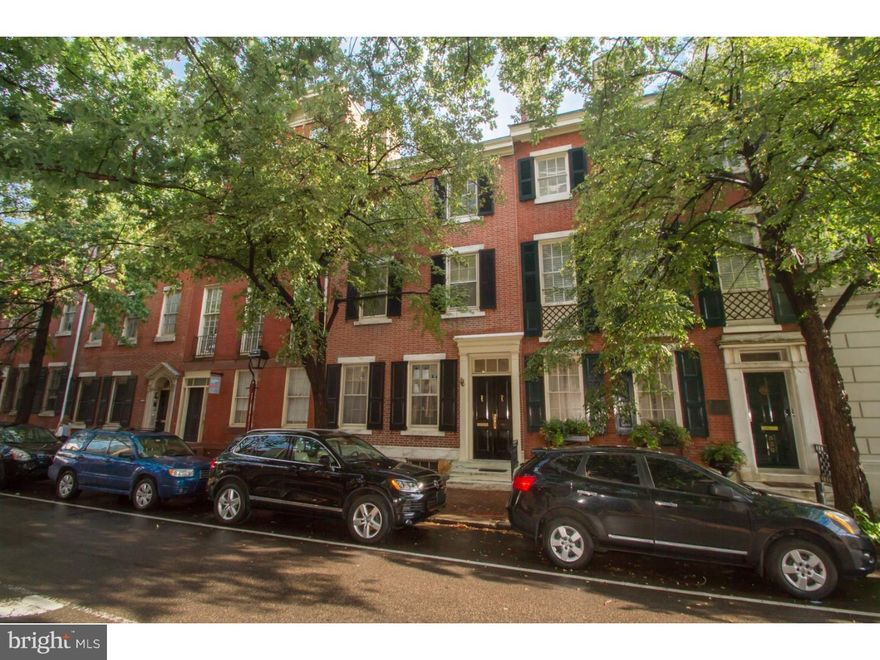 Stately and immaculate 3-4 bed, 4.5 bath newly renovated Society Hill home located on one of the finest tree lined blocks in Philadelphia. This elegant home features gorgeous detailed moldings, grand ceilings, tremendous light and plenty of living space for all your needs. Be greeted by the handsome, restored historic brick fa ade with shutters and marble steps. Grand double doors lead into the elegant foyer with a soaring ceiling, detailed moldings, architectural pillars and marble floor. Relax in the sophisticated living room featuring a wood burning fireplace with marble and wood mantle and 2 large windows. Host parties in the dining area, which offers a fireplace, pristine crystal chandelier and French doors to a charming, picturesque red brick garden. The handsome kitchen entices any chef with its white cabinetry, granite countertops, stainless steel appliances, marble tile backsplash, 3 large side windows, and ceramic floor. The bar counter opens to the classic breakfast area with dramatic floor to ceiling window and glass door to rear patio. Grand circular staircase leads up to the 2nd level. Open foyer with unique domed skylight allowing brilliant light to flow throughout this lovely home. Beveled French doors into the inviting library with an elegant bay of windows, built-in shelving and architectural pillars. From the hall you'll find a laundry closet for your utmost convenience plus a full bath. The master bedroom suite offers ultimate comfort with a wood burning fireplace and seemingly endless storage space with 2 walk-in closets, 2 double closets and a linen closet. The all-new master bathroom is to die for?enjoy soaking in your elegant claw foot tub while taking in the southern sunlight from the large window above? just one of the features of this classy bath. You will love its marble tile floor, half wall wainscoting, double vanity with marble countertop, heated towel rack and spacious all-tile stall shower. Wood steps lead to the 3rd level where you'll find 2 sun-filled bedrooms and a gorgeous all-new bath.  Steps take you up to a dormer studio suite with skylight allowing tremendous light, exposed brick wall and private bath. The basement is ideal for all your storage needs, while also hosting the mechanicals (multi-zoned gas and electric heating throughout). Offering 1 year prepaid parking at Independence Park (half block away). Don't miss your chance to enjoy classic luxury and modern elegance at its finest!