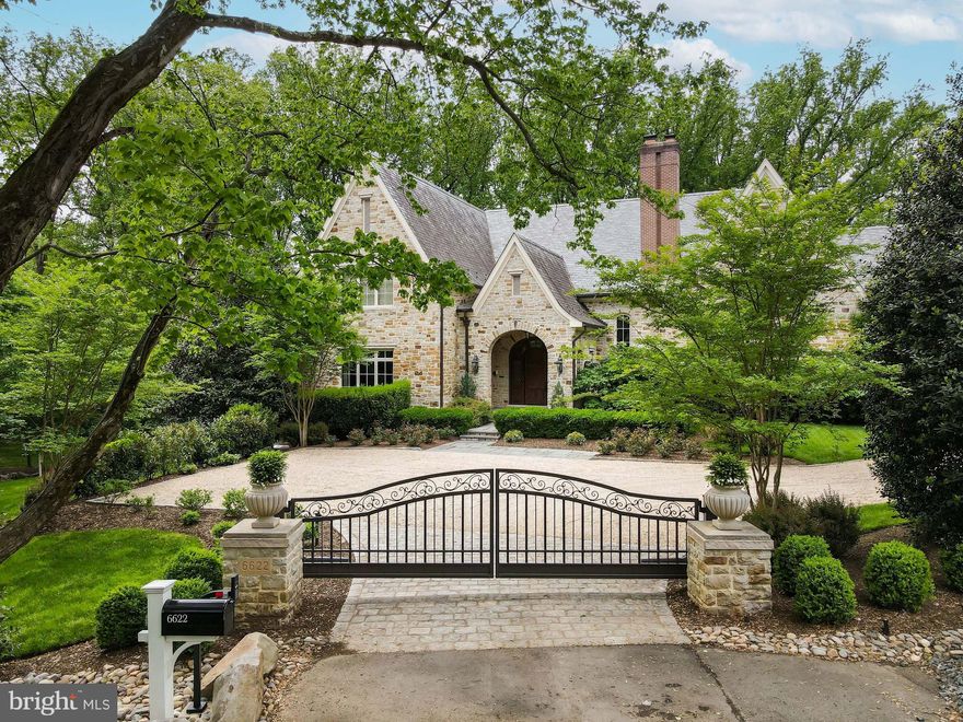 Prepare to be captivated by the opulent transformation of this French Country custom estate. A meticulous and extensive renovation has elevated this residence to a realm of unparalleled luxury. Nestled within the prestigious Langley Farms, this grand 13,000 sq ft sanctuary sits on an expansive 1.17-acre lot, ensconced in immaculate landscaping. Designed by the esteemed Sutton Yantis Associates and crafted by Bowman & Associates, this architectural masterpiece radiates a resort-like allure. Every detail has been thoughtfully curated, from the Antiqued Ashlar Stonework to the Vermont slate roof, copper gutters, and downspouts. The pièce de résistance is the inviting heated pool with its graceful waterfall, creating a tranquil oasis in your own backyard. The outdoor space is a paradise of its own, featuring a stacked stone Fireplace with a charming Pergola, a picturesque pond with a cascading waterfall, and sprawling park-like grounds adorned with majestic trees. Flagstone Patios & Terraces provide ample spaces for relaxation and entertainment, inviting you to savor the serene beauty of nature. As you step through the grand custom door with exquisite inlaid cut glass, a world of elegance unfolds. The formal Foyer welcomes you with a stunning staircase, setting the tone for the luxury that awaits. The Living Room boasts a comforting Fireplace and French Doors leading to the Flagstone Terrace, while the banquet-sized Dining Room is graced with a dramatic floor-to-ceiling inlaid wood mantle and French doors opening to a private garden. A complete Butler's Pantry off the Dining Room offers both display and storage space, adorned with marble countertops, under-cabinet refrigerator, and wine chiller. The Library, paneled in rich mahogany, features floor-to-ceiling built-in custom cabinetry and beckons you through beautiful French Doors into the Living Room. The Family Room is a visual masterpiece with its dramatic 2-story beamed ceiling, stone Fireplace, and double French doors that open to the Flagstone Terrace. The renovated gourmet Kitchen boasts custom cabinetry, top-of-the-line appliances, and a cozy floor-to-ceiling stone fireplace. Adjacent, the Breakfast Room is surrounded by windows, creating the perfect spot to start your day with a view. Ascending to the Upper Level, you'll discover the luxurious Owner's Suite Bedroom with French doors leading to a private covered Balcony. A Sitting Room awaits, complete with Balcony access, Fireplace, and a Morning Bar. The dressing area includes two custom Closets and a large cedar Closet. The opulent Bath is a masterpiece with heated Turkish marble floors, a cove-lighted tray ceiling, freestanding soaking tub, and a glorious shower with rain shower and body sprays. The Upper Level also comprises four additional en suite Bedrooms, each with meticulously renovated Bathrooms, and one graced by an additional Fireplace. Descending to the Lower Level, you'll find an entertainment haven. A Recreation Room beckons with a fireplace, fully equipped Wet Bar. The Wine Cellar and Tasting Room designed to accommodate 500+ bottles, awaits the connoisseur. Additional spaces include a Billiard Room/Bedroom, Full Bath, Fitness Room, Sauna, and a Golf Room with a fully interactive Golf Simulator. Multiple sets of French doors lead to the covered lower Flagstone Terraces and the rear tranquil garden grotto. This haven is adorned with clematis-covered arbors, a stone fountain, and beautiful rose and hydrangea gardens. This remarkable residence is thoughtfully equipped with modern conveniences, including a custom-designed Entry Gate, Elevator with 3-level access, Vacuflo central vacuum system, natural gas Generator, and an oversized 3-car garage. This is not just a home; it is a masterpiece of luxury living, offering an unparalleled lifestyle in the heart of Langley Farms. Experience the epitome of elegance and comfort in this meticulously curated estate.