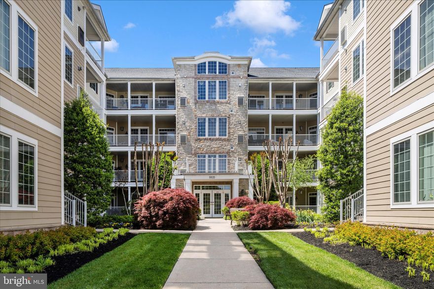 Welcome to 8820 Shining Oceans Way #105—an impeccably maintained, move-in ready 55+ condominium offering the perfect blend of comfort, style, and easy living. This light-filled home features 3 spacious bedrooms, 2 full baths, and an open-concept layout designed for both everyday living and entertaining.
The beautifully appointed kitchen boasts abundant cabinetry, generous granite counter space with bar seating, and a convenient pantry, all opening seamlessly to the expansive living and dining areas. These inviting spaces are enhanced by elegant wainscoting, a cozy gas fireplace, and a wall of triple windows that flood the home with natural light.
The generously sized primary suite offers a peaceful retreat, highlighted by chair rail detailing, custom ceiling molding, and a spacious walk-in closet outfitted with custom California Closets, providing a beautifully designed and highly functional organization system. The spa-inspired bath features a dual sink vanity, a Jacuzzi jetted tub, and a separate tiled walk-in shower. A standout feature is the double-sided gas fireplace, creating a warm, elegant connection between the primary bedroom and the main living area.
Two additional bedrooms are thoughtfully situated on the opposite side of the home, providing privacy and flexibility for guests or a home office, and share a well-appointed full bath. Each bedroom closet is outfitted with custom California Closets, providing beautifully designed and highly functional storage solutions.
A dedicated laundry room with an all-in-one washer/dryer adds convenience while maximizing additional storage space.  Also included is the 65" wall mounted TV, soundbar, and subwoofer in the living room.; and the 43" TV in the primary bedroom.
Snowden Overlook is a vibrant, gated 55+ community offering an exceptional, resort-style lifestyle. Residents enjoy a full-time staffed clubhouse featuring a fitness center, party room, and gathering spaces, along with a heated in-ground pool open seasonally. The community is known for its active social calendar, with a wide variety of clubs and activities that make it easy to connect and stay engaged. Added peace of mind comes with a security gate and a manned guardhouse during evening hours.
The Ovation building offers the convenience of elevator access and includes an assigned parking space in the secure underground garage.
Ideally located at Snowden River Parkway and Route 175, Snowden Overlook provides effortless access to I-95, Route 100, and Route 32, as well as nearby shopping, dining, medical facilities, entertainment, and BWI Airport—making everyday living both convenient and connected.