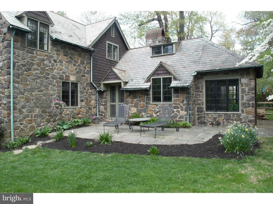 Charming stone Old World Tudor with vaulted living room ceiling, exposed beams and stone wood burning fireplace. Step-down dining room with beamed ceiling, cozy den with stone wood burning fireplace. Rounded walls and exceptional mill work featured throughout the house. Kitchen with gas fireplace and sliding doors to flagstone terrace. A master suite with dressing room and bath plus three bedrooms. Two full, one half, baths on the upper level and powder room on the first floor. Back stairs. Lovely, private, level lot on cul-de-sac street. Many outdoor living spaces.