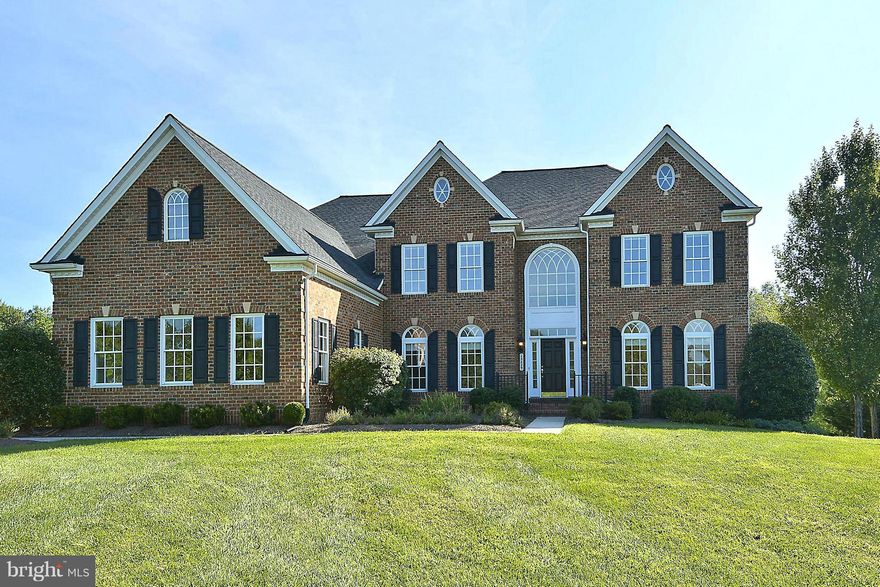 Luxury Living at its Best!  The 2-story Foyer and open floor plan welcomes all of your guests as you enjoy a picturesque wooded view of your acre of open land.  An open and airy Kitchen and Sun Room allow you plenty of space to entertain and a luxurious Master suite awaits you at night.  The lower level is complete with an in-law suite including Rec Room, Office & 2nd laundry and walk-out bsmt.