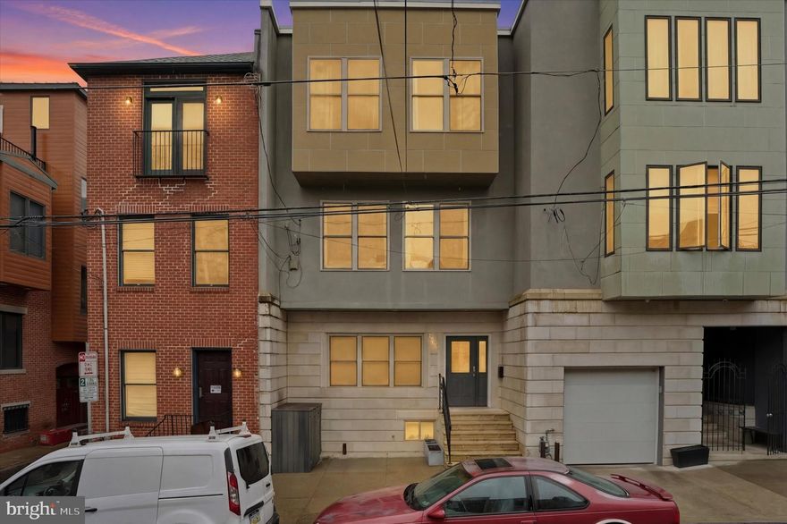 Located on a quiet block in the heart of Northern Liberties, 1011 N Orianna Street presents a rare opportunity to own an exceptionally large, new-build from 2009 offering over 5,000 square feet of living space with extraordinary flexibility. Configured with 8 bedrooms and 5.5 bathrooms, the home features multiple living areas, two full kitchens, and a lower-level kitchenette, creating an ideal setup for intergenerational living, large households seeking privacy within a shared home, or buyers looking to continue operating a high-performing short-term rental investment that is on Airbnb and VRBO. The thoughtful layout allows the property to function almost like several homes under one roof. The main level includes a spacious kitchen, living and dining areas, two bedrooms, and access to a rear deck and shared patio. The finished lower level provides additional living space with a kitchenette, two bedrooms, a full bathroom, and direct patio access. The second floor offers another kitchen, multiple living areas, a dining space, and a half bath, while the upper level contains four additional bedrooms, including a primary suite with an ensuite bath, plus convenient second-floor laundry. Multiple gathering areas and kitchens allow residents or guests to spread out comfortably while still enjoying shared spaces. Just steps from the vibrant restaurants, cafés, parks, and boutiques that define Northern Liberties, the home offers easy access to Old City, Center City, and major cultural destinations, including the Philadelphia Museum of Art and The Franklin Institute. With its scale, flexible layout, and prime location in one of Philadelphia’s most dynamic neighborhoods, 1011 N Orianna Street represents a unique opportunity for both homeowners and investors alike.